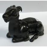 A Chinese bronzed lead figure of a "Recumbent Goat", 18 cm long x 13.2 cm highCondition ReportHas