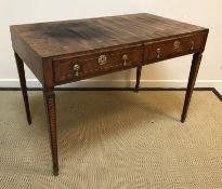 A circa 1800 Italian walnut and inlaid writing table, the top with parquetry banded decoration