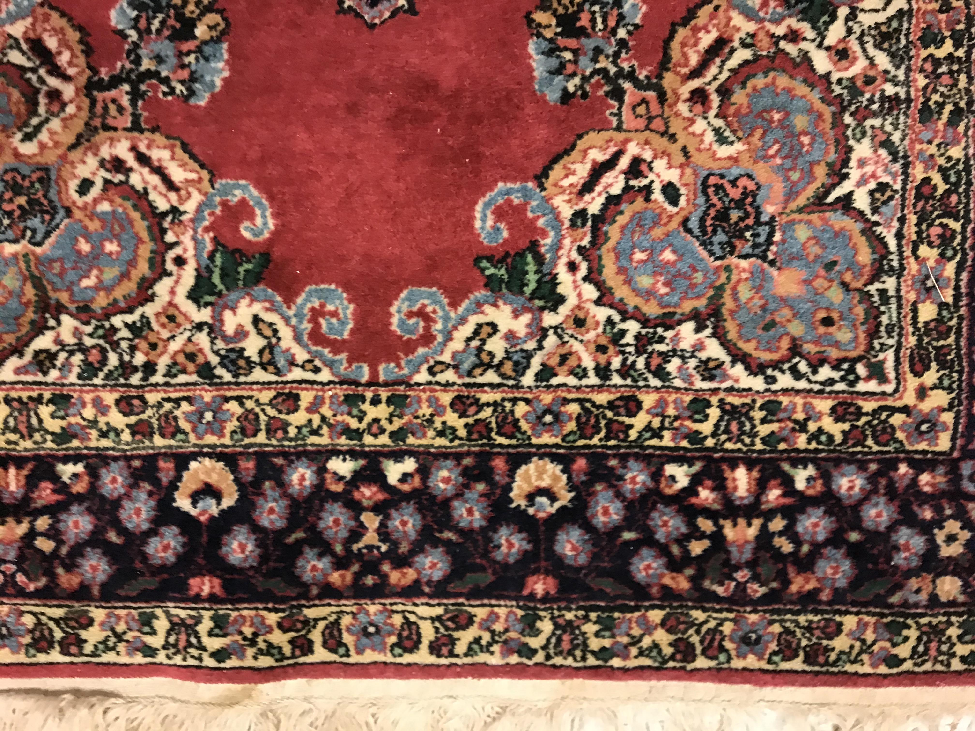 A pair of fine Oriental rugs, the central panels set with floral decorated circular medallion on a - Image 19 of 41