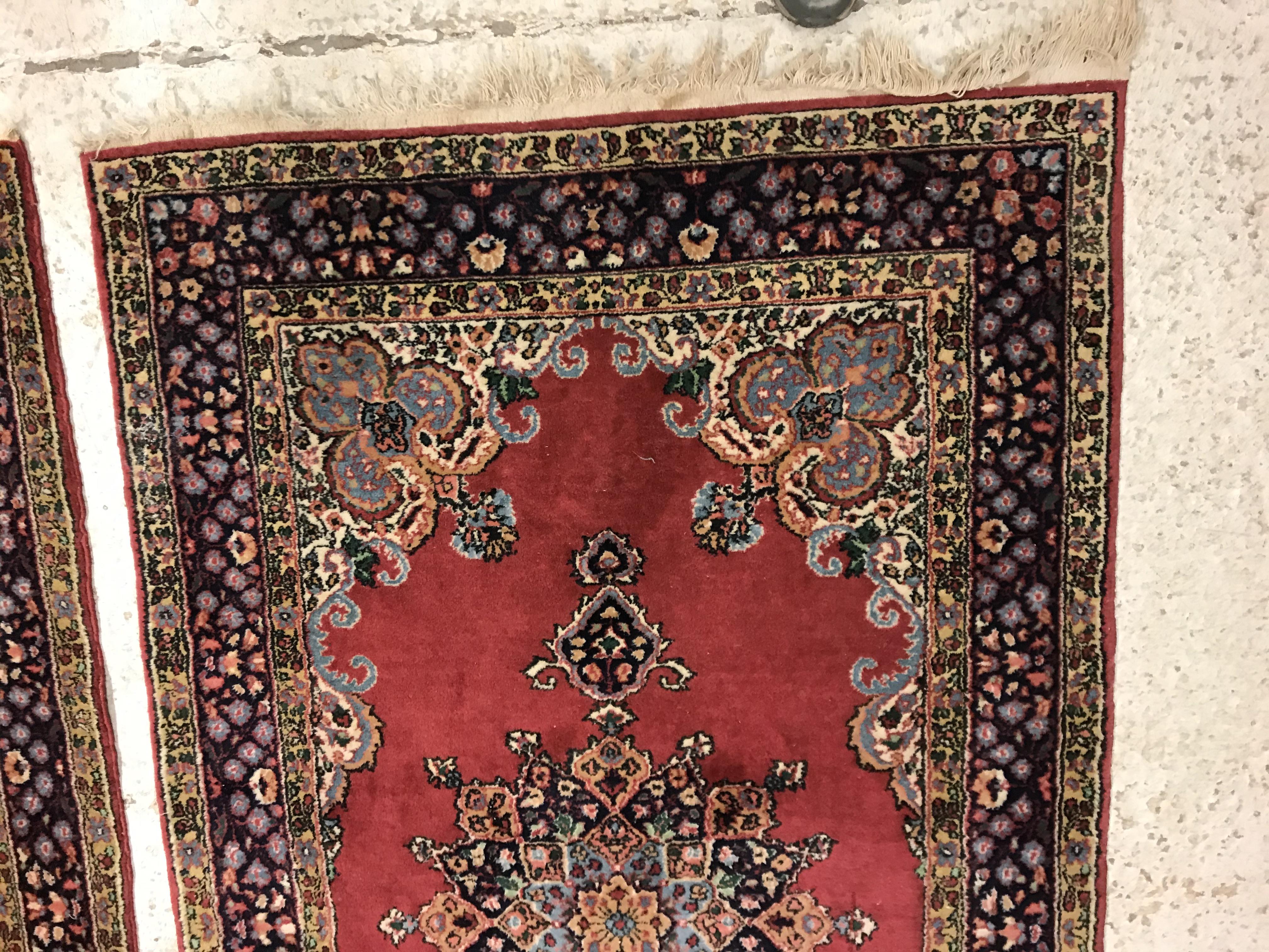 A pair of fine Oriental rugs, the central panels set with floral decorated circular medallion on a - Image 5 of 41