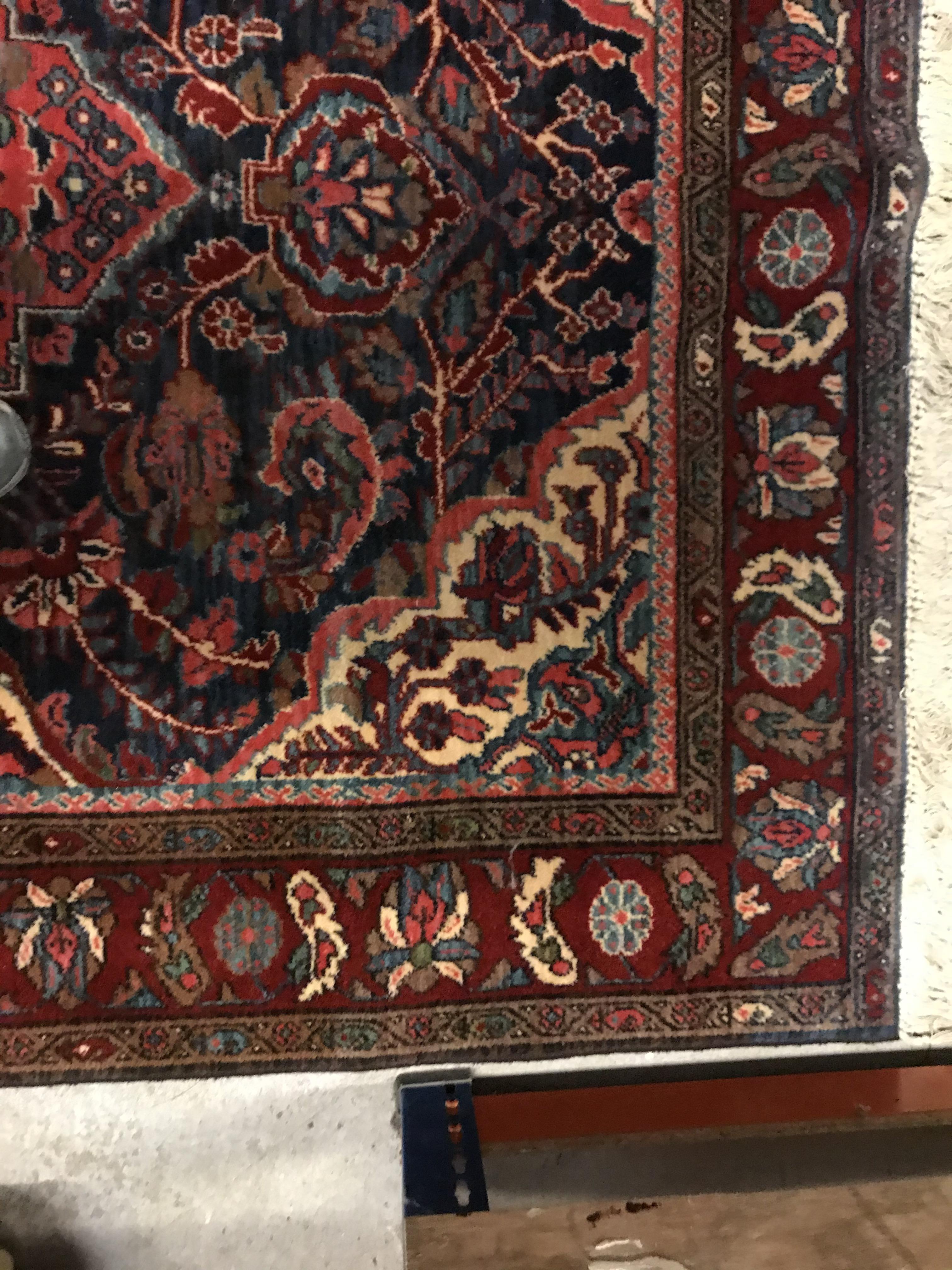 An Oriental carpet, the central panel set with foliate decorated medallion on a red and blue - Image 7 of 11