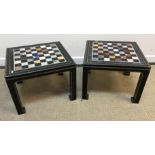 A pair of black lacquered and gilt decorated Chinese style occasional tables, the square tops set