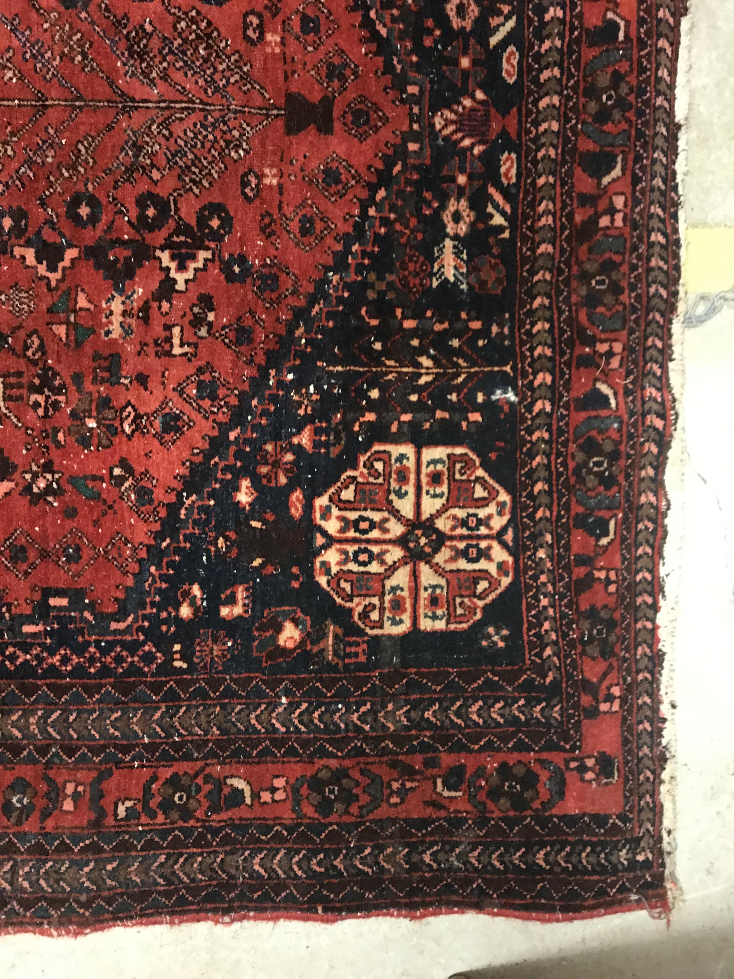 A Caucasian rug, the central panel set with three repeating medallions on a pale blue ground, within - Image 21 of 33