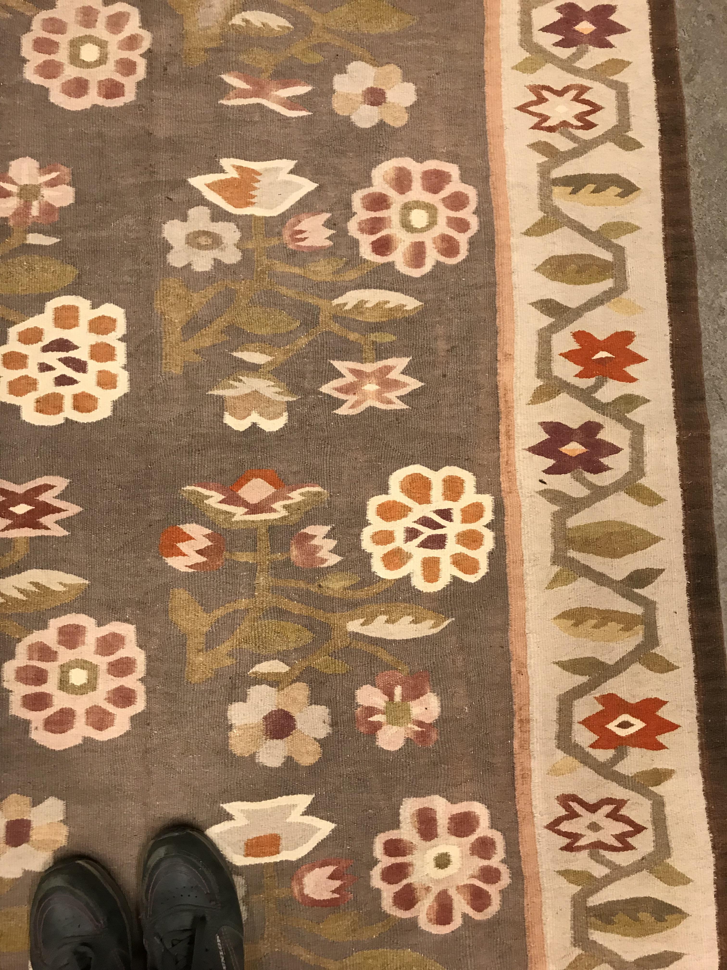 A Kelim rug, the central panel set with floral sprays on a mushroom ground, within a stepped border, - Image 4 of 16