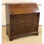 A 19th Century mahogany bureau, the plain top above a sloping fall enclosing a fitted interior