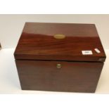 A Victorian mahogany stationery box, the sloping top opening to reveal a fitted interior over two