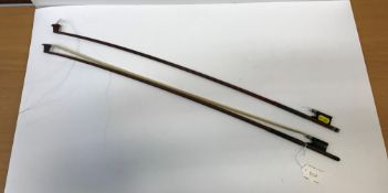 An octagonal mahogany violin bow stamped "Adam Heinrich" with mother of pearl inlaid ebony frog,