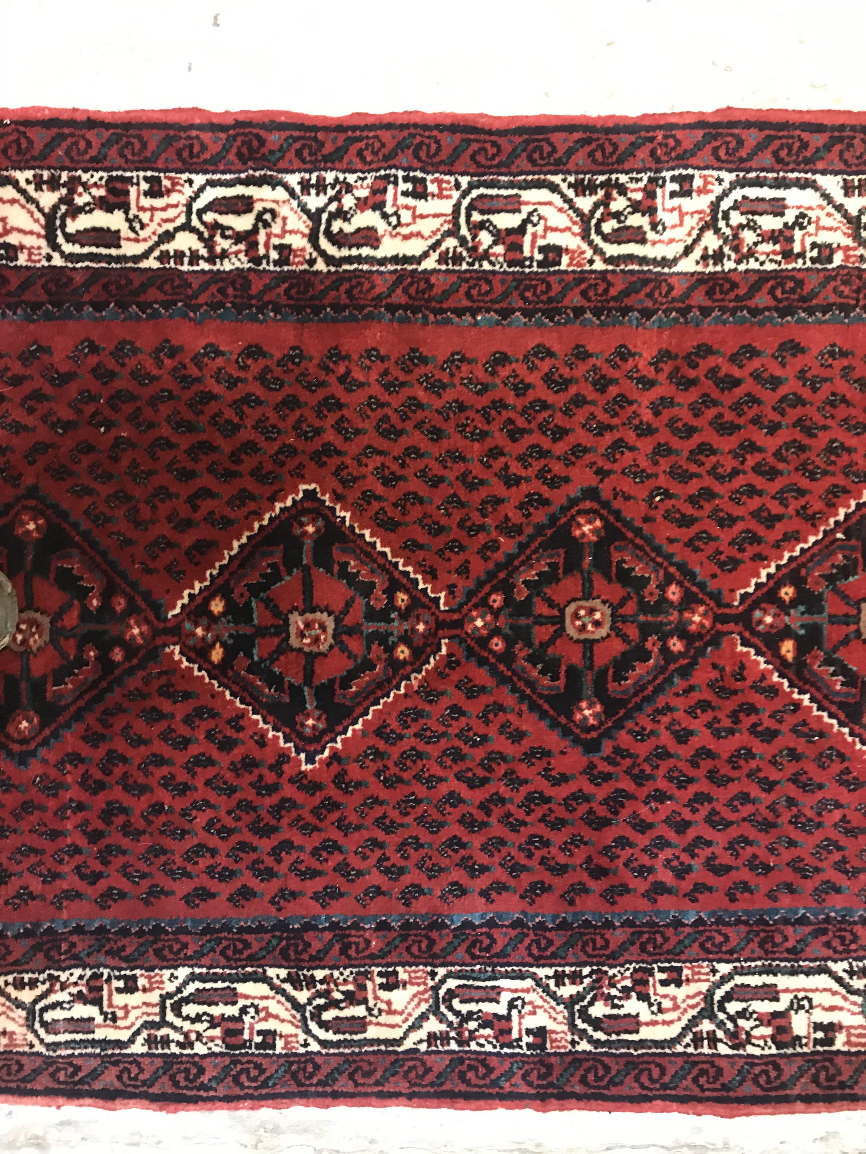 A modern Persian (Iran) runner, the red ground with repeating lozenge medallion with hook style - Image 6 of 23