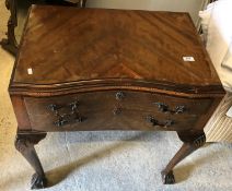 A 1930's mahogany and inlaid inverted serpentine fronted two drawer canteen table on shell carved