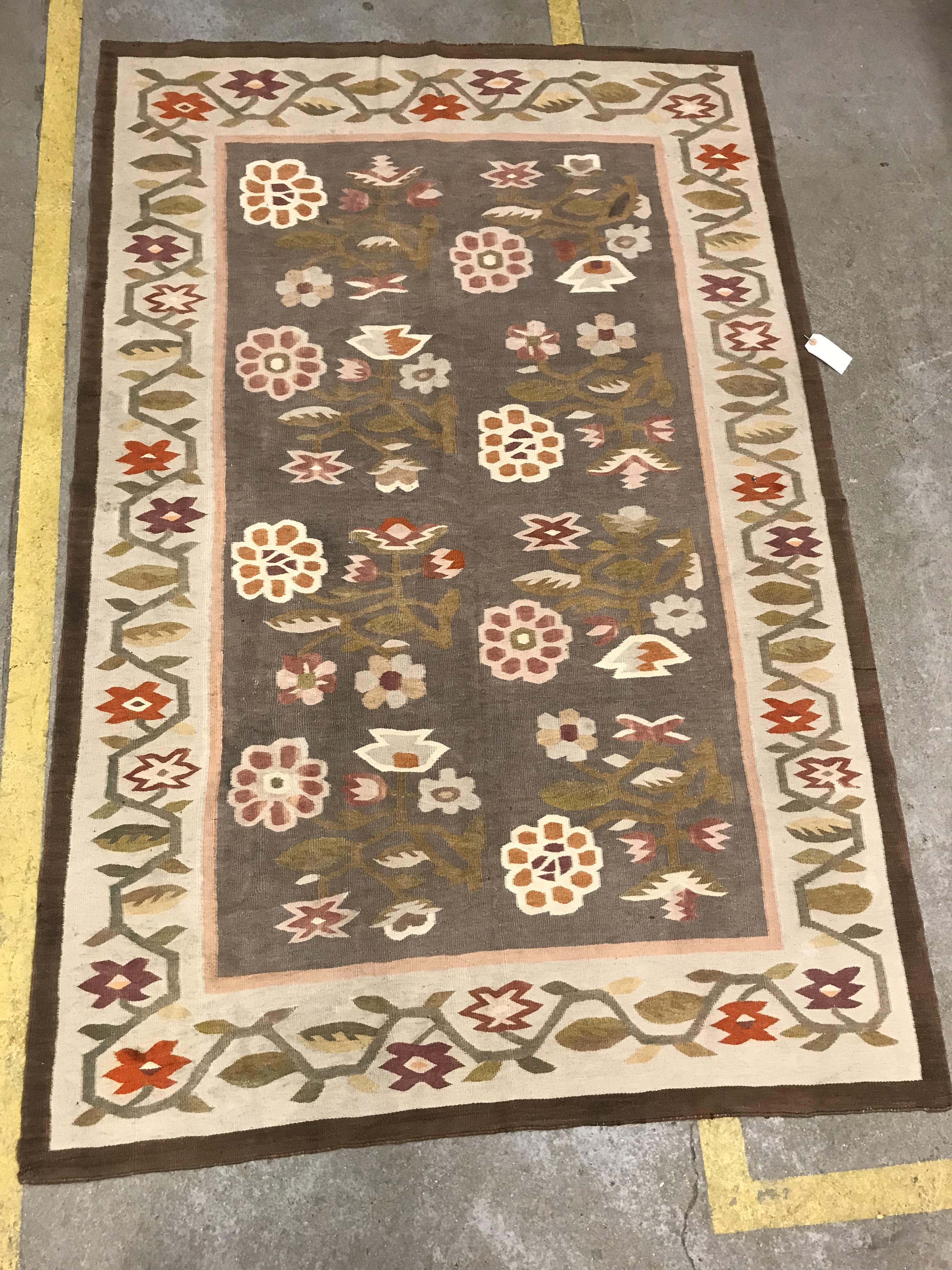 A Kelim rug, the central panel set with floral sprays on a mushroom ground, within a stepped border, - Image 8 of 16