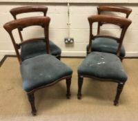 A set of four Victorian mahogany bar back dining chairs with upholstered seats on turned and foliate
