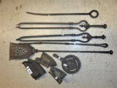 A collection of five various 19th Century steel fire irons, three flat irons and an Elizabeth II