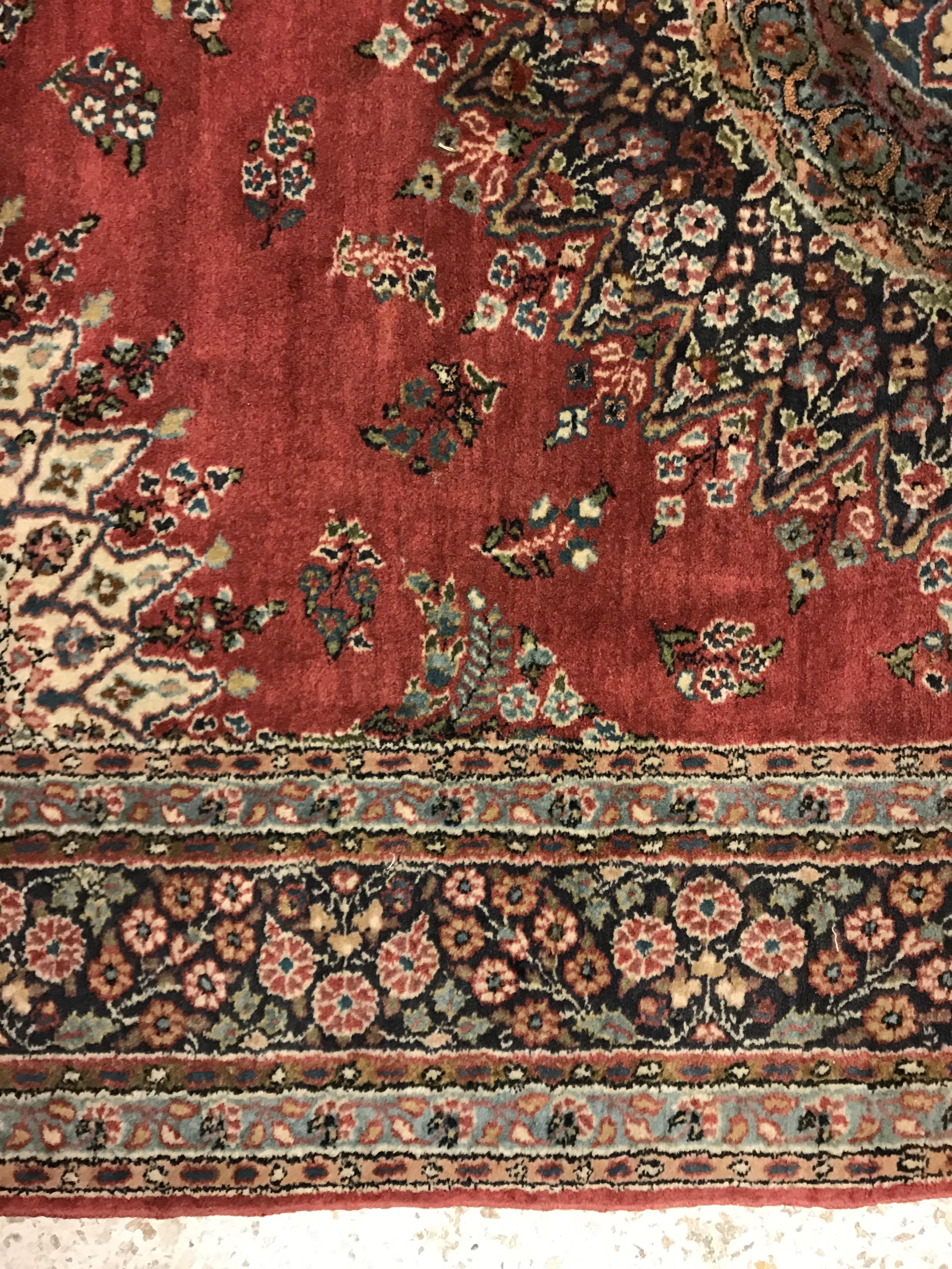 A pair of fine Oriental rugs, the central panel set with floral decorated circular medallion on a - Image 27 of 48