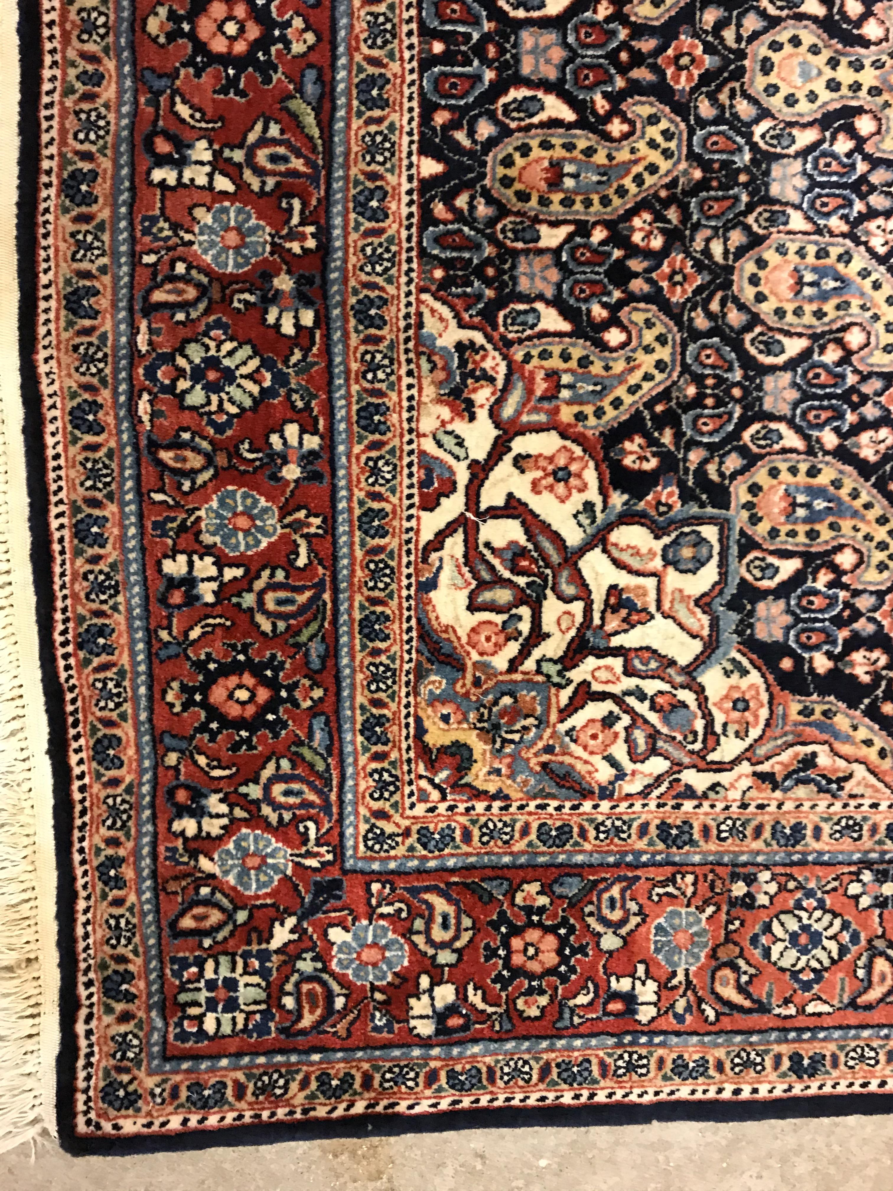 A Kashan carpet, the central panel set with floral decorated medallion on a dark blue hook decorated - Image 4 of 14