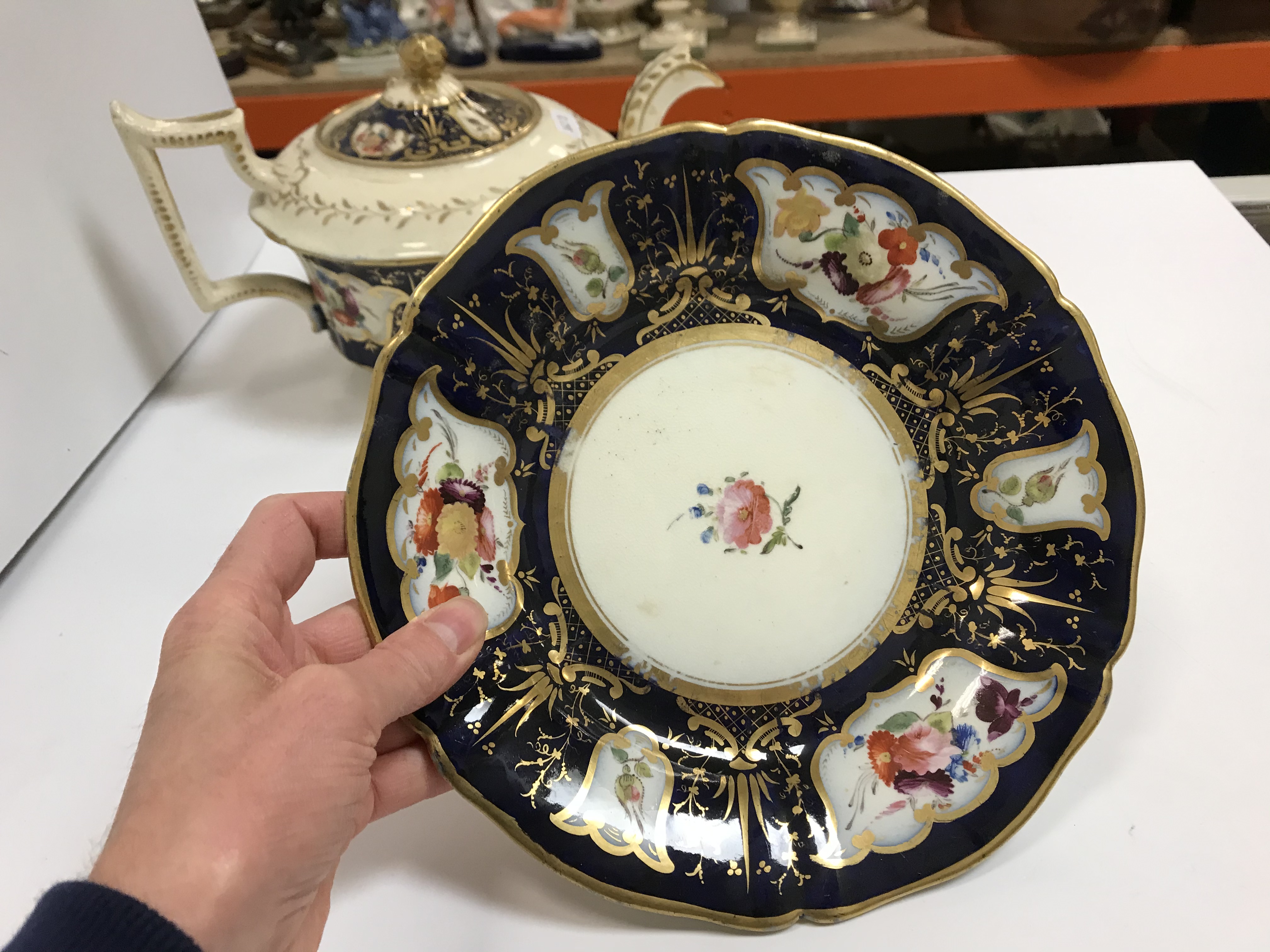 A 19th Century Staffordshire pottery part tea set, royal blue banded and gilt lined with panels of - Image 10 of 45