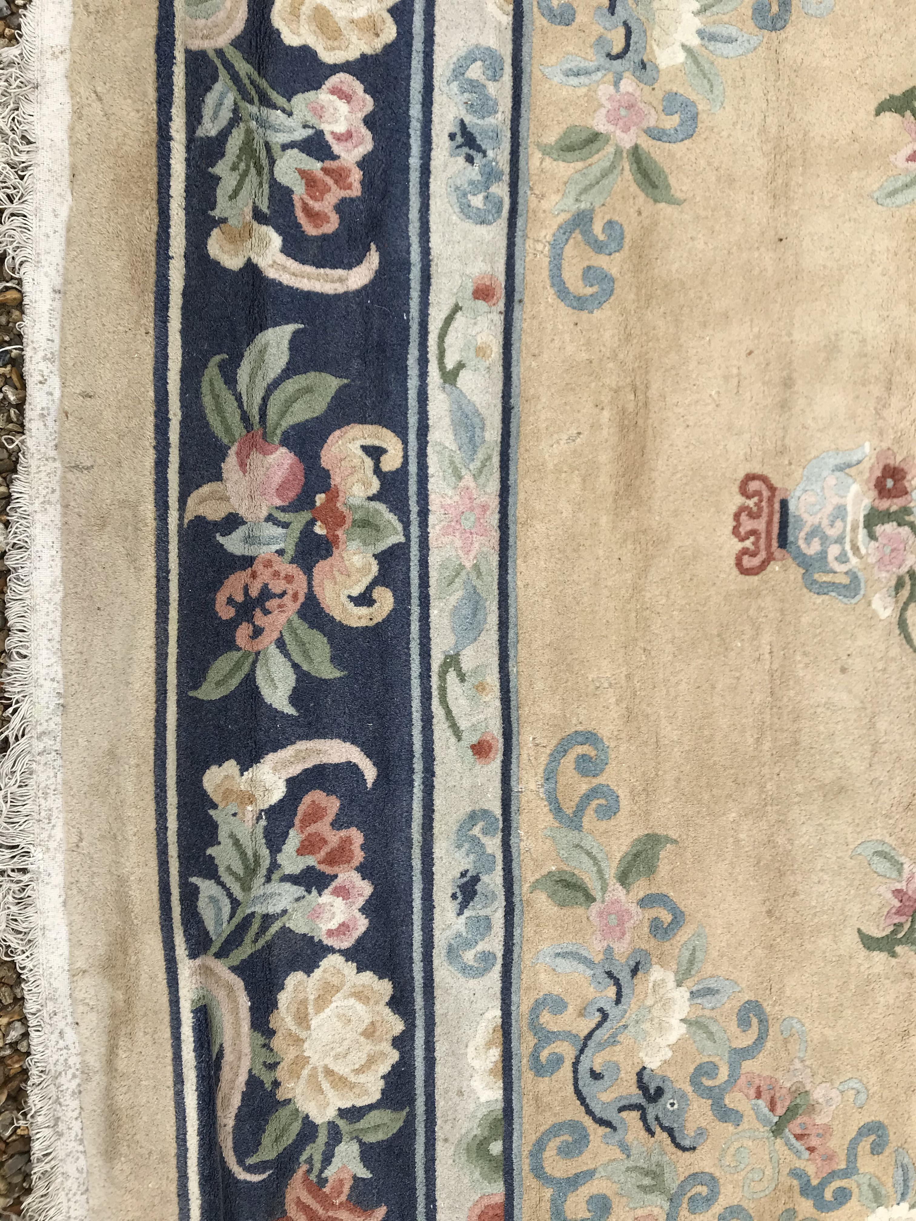 A Chinese Superwash rug, the central panel set with dragon motif on a gold ground, set with floral - Image 3 of 21