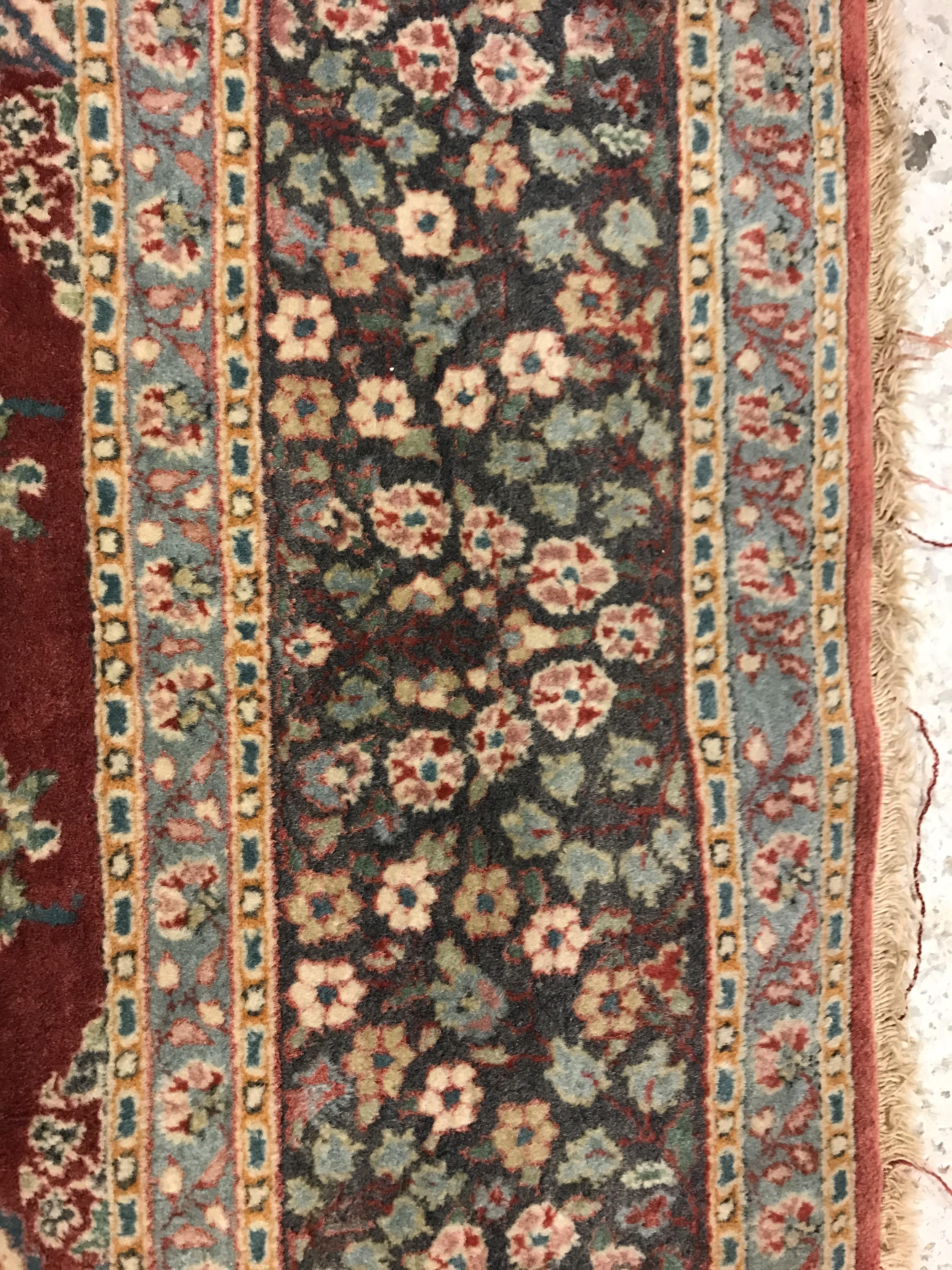 A pair of fine Oriental rugs, the central panels each set with floral decorated circular medallion - Image 36 of 41