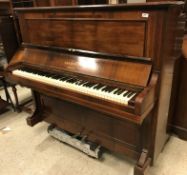A circa 1900 rosewood cased upright piano, the iron framed straight strung movement No'd. "27584" by