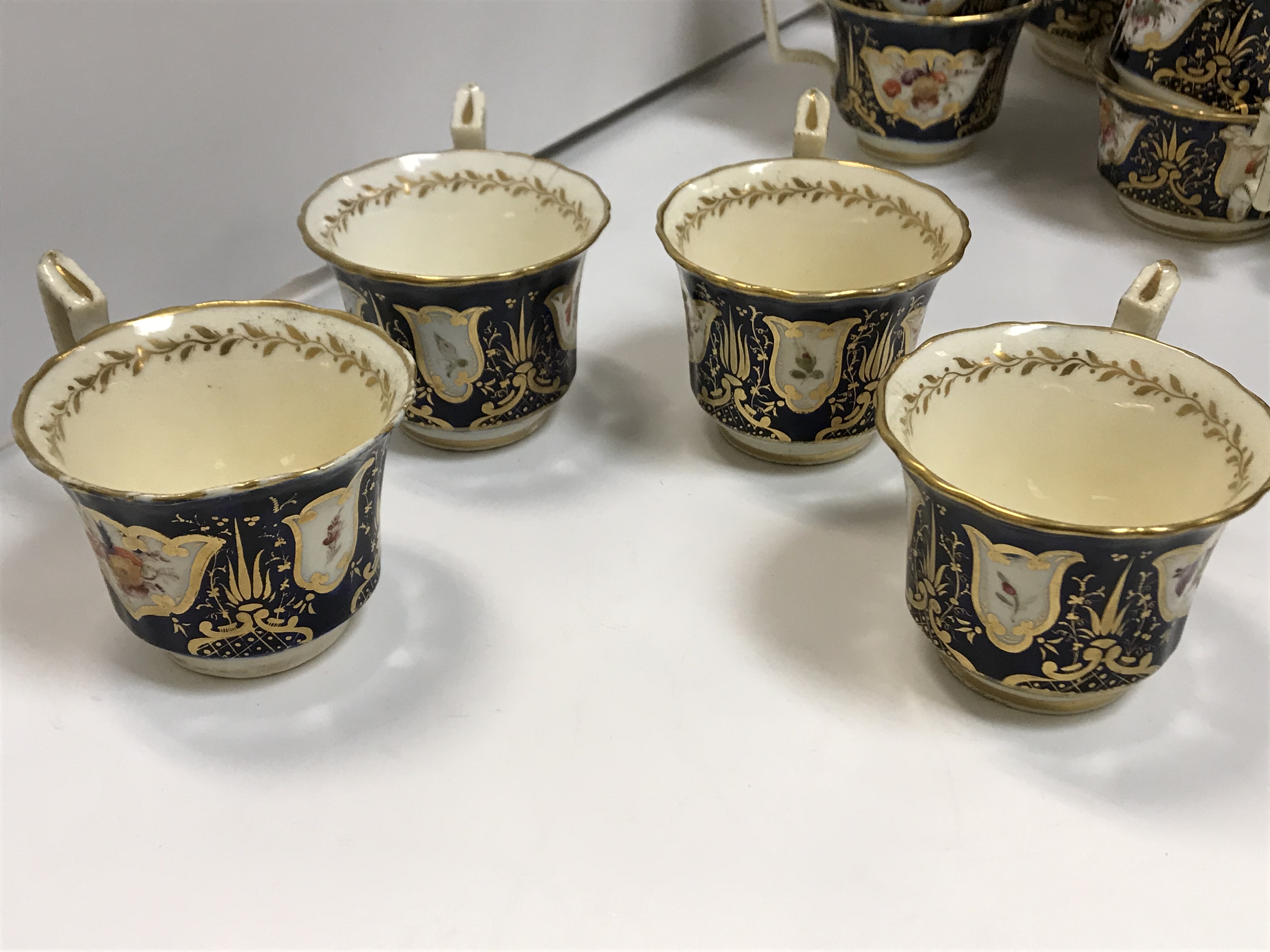 A 19th Century Staffordshire pottery part tea set, royal blue banded and gilt lined with panels of - Image 29 of 45