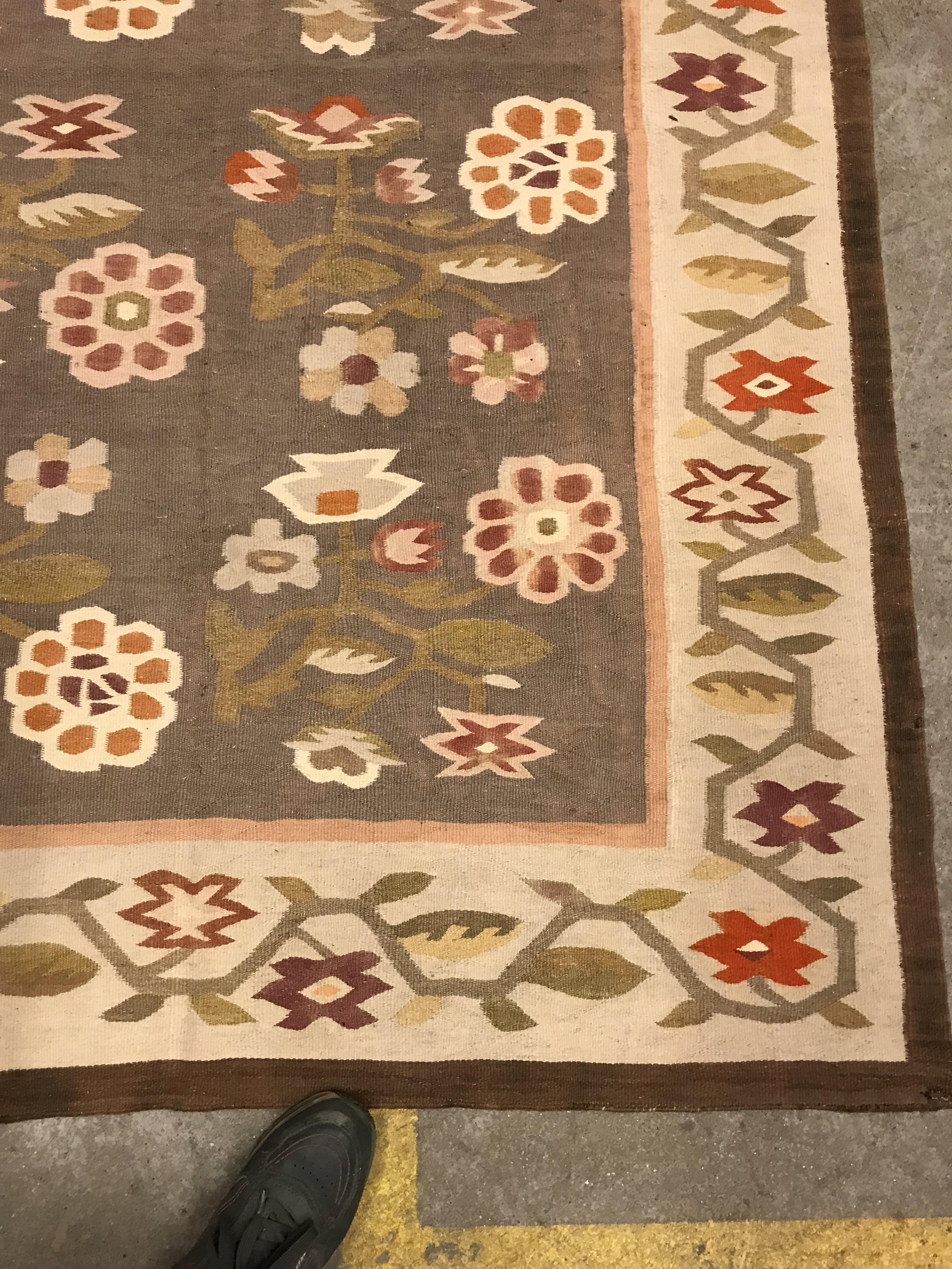 A Kelim rug, the central panel set with floral sprays on a mushroom ground, within a stepped border, - Image 3 of 16