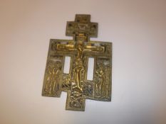 A 19th Century Russian enamelled brass reliquary cross depicting "Christ upon the cross" with