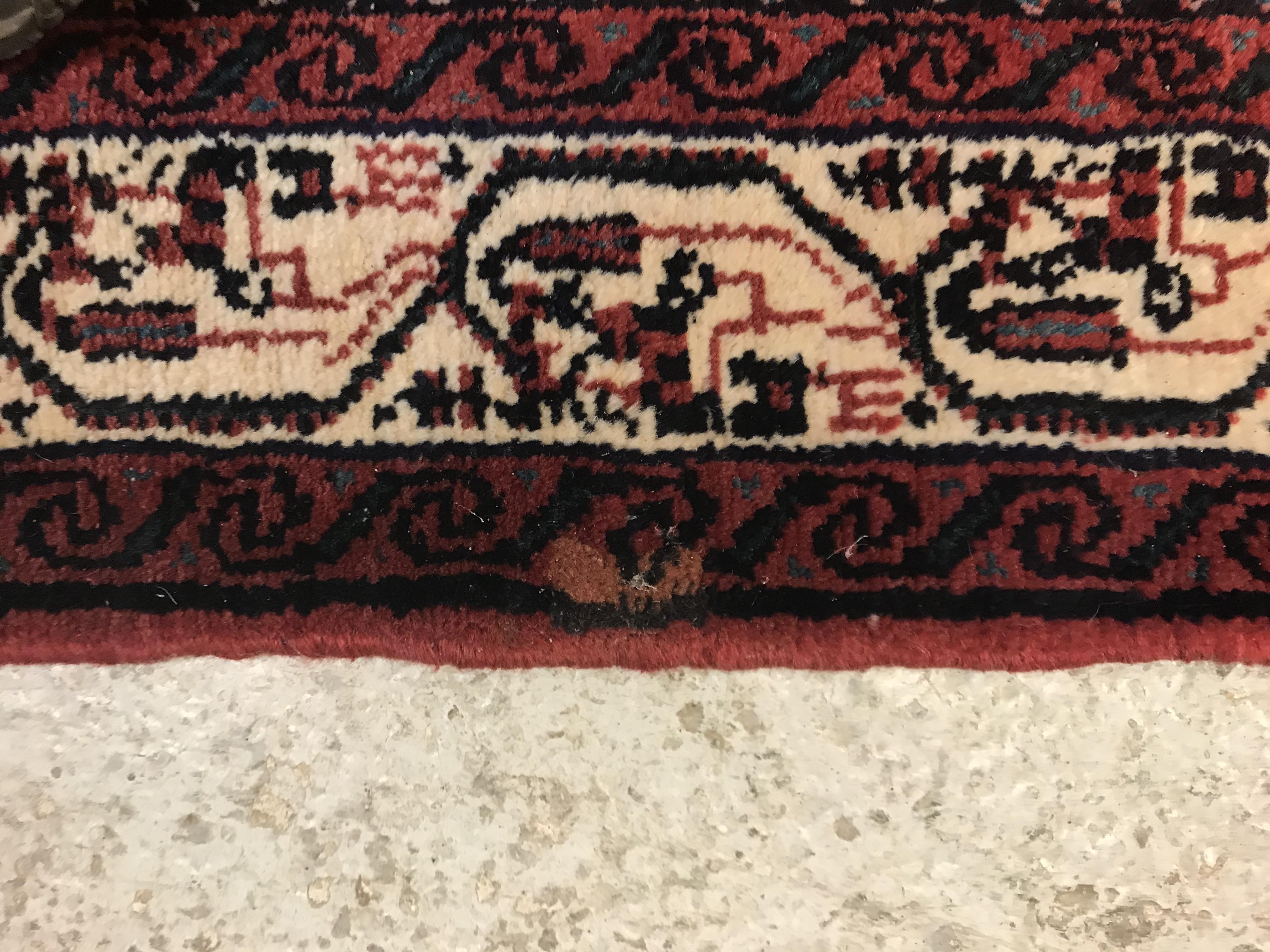 A modern Persian (Iran) runner, the red ground with repeating lozenge medallion with hook style - Image 18 of 23