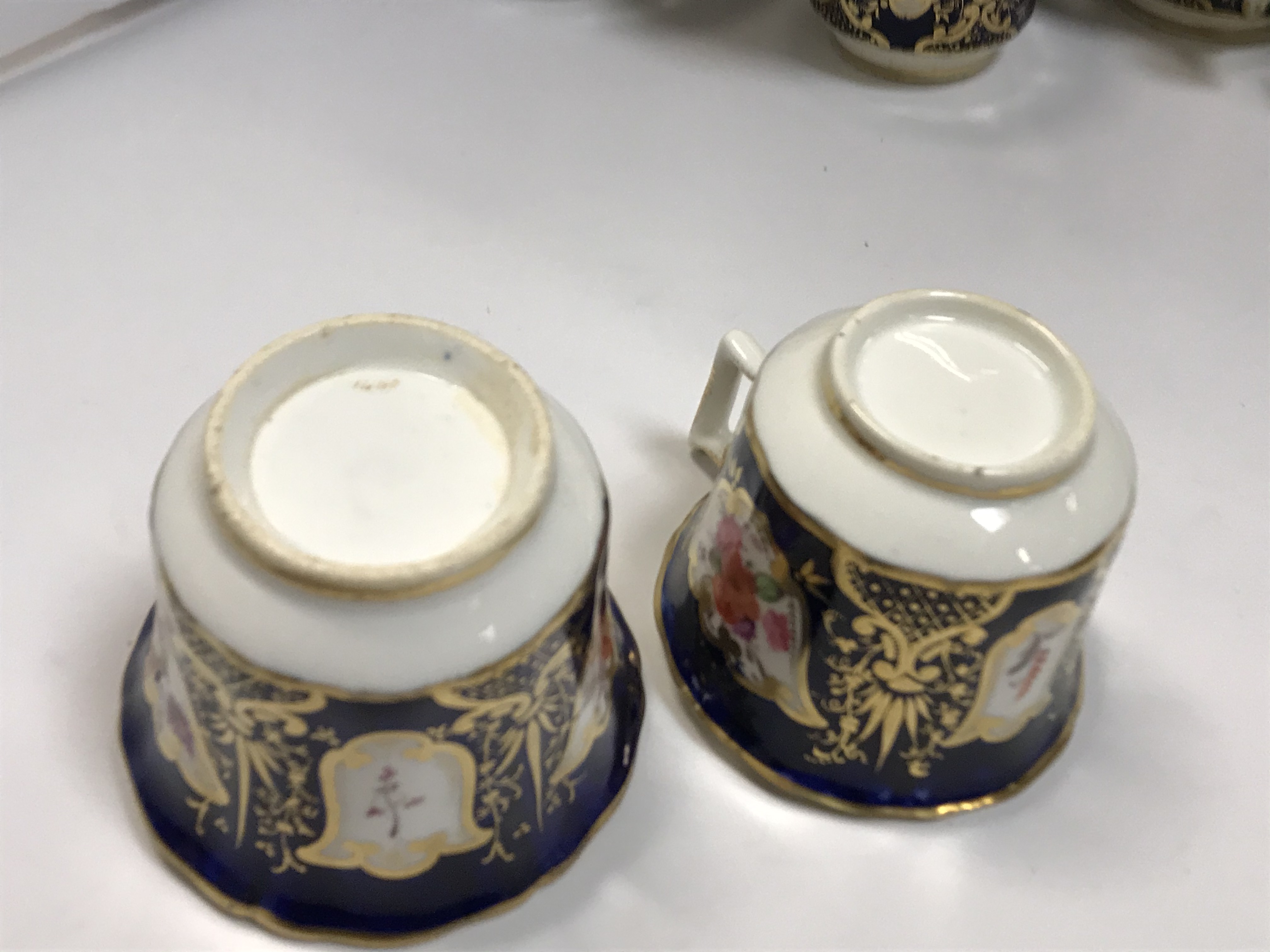 A 19th Century Staffordshire pottery part tea set, royal blue banded and gilt lined with panels of - Image 45 of 45