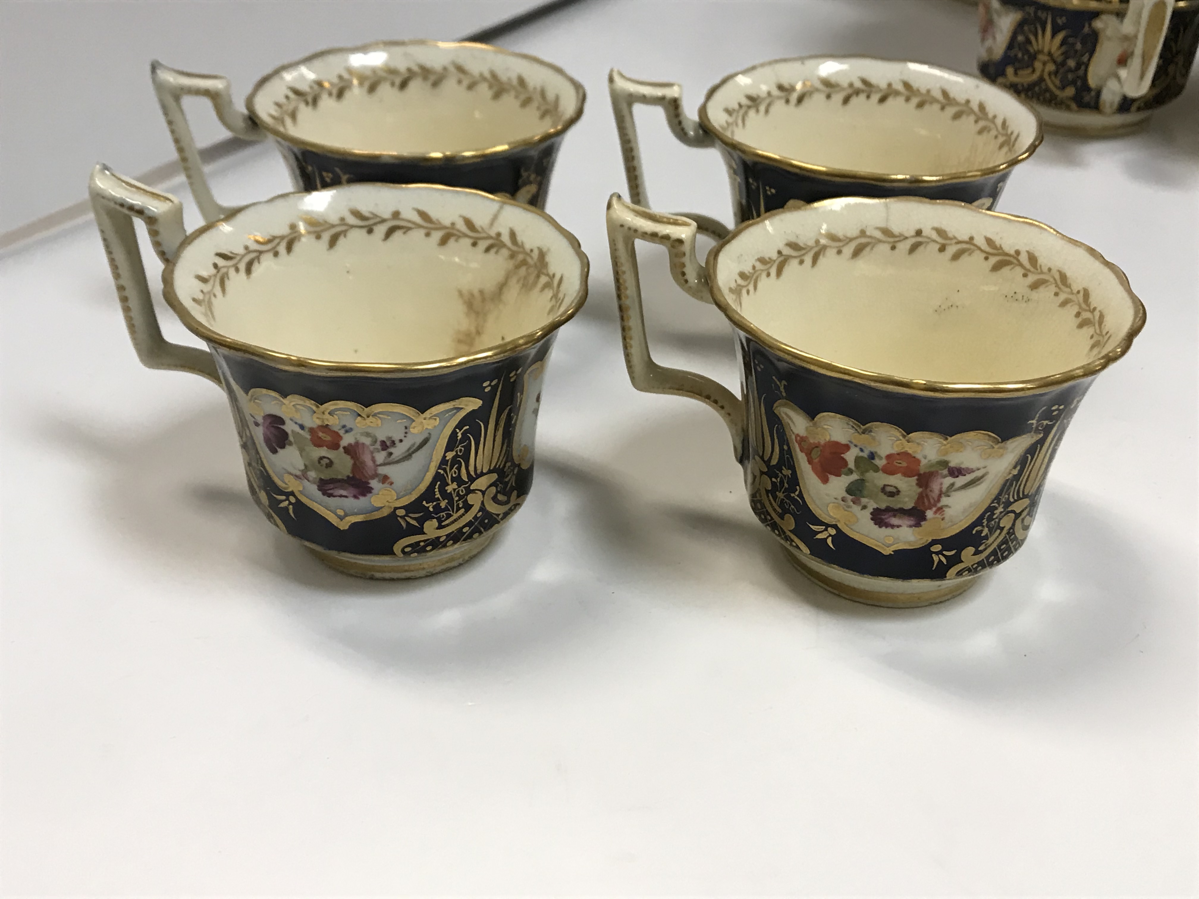 A 19th Century Staffordshire pottery part tea set, royal blue banded and gilt lined with panels of - Image 23 of 45