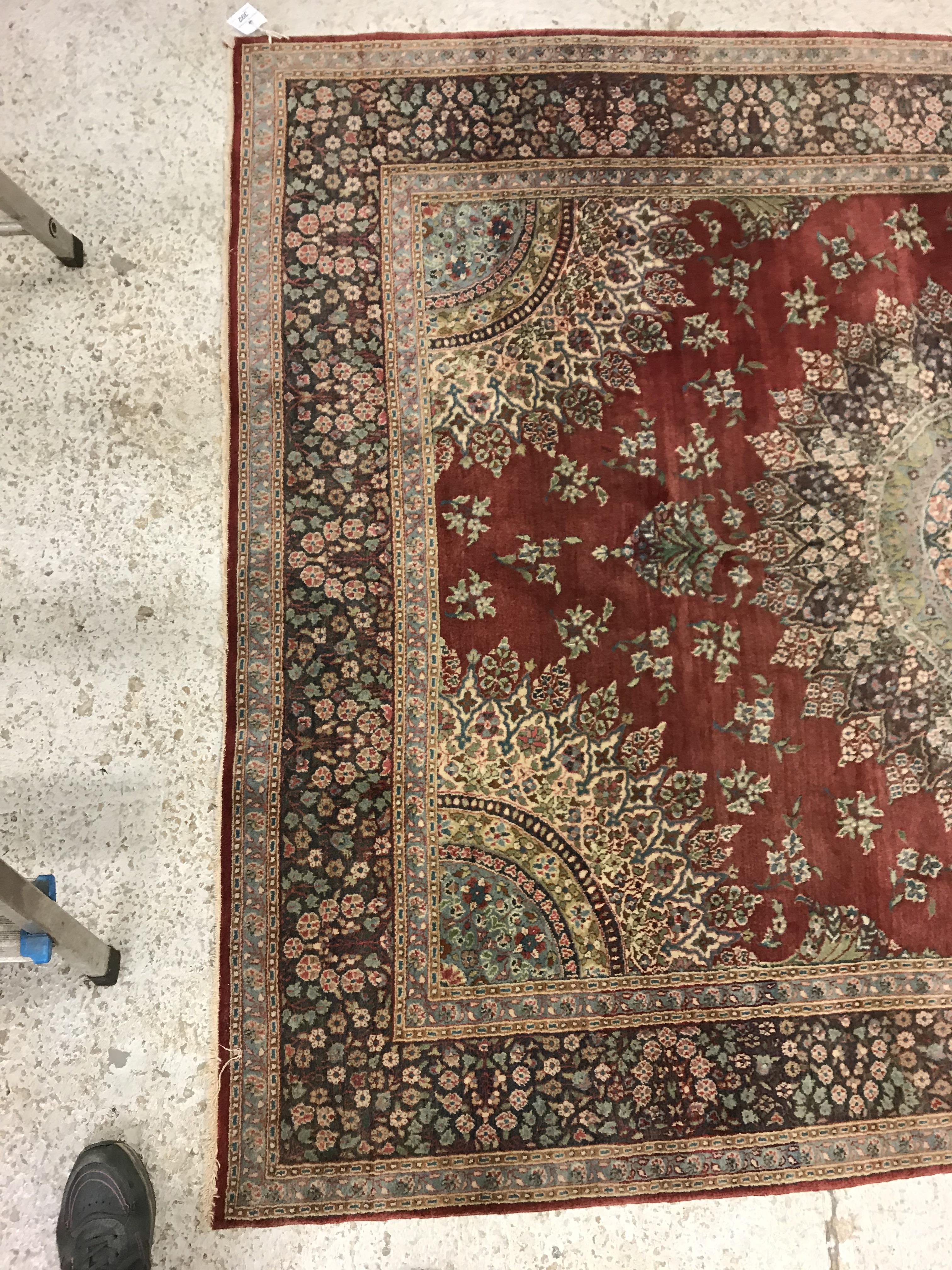 A pair of fine Oriental rugs, the central panels each set with floral decorated circular medallion - Image 2 of 41