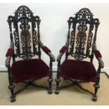 A pair of 19th Century oak and carved throne type chairs in the Carolean taste with upholstered