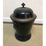A 19th Century toleware coal box, black painted and gilt banded, the domed top with mushroom finial,