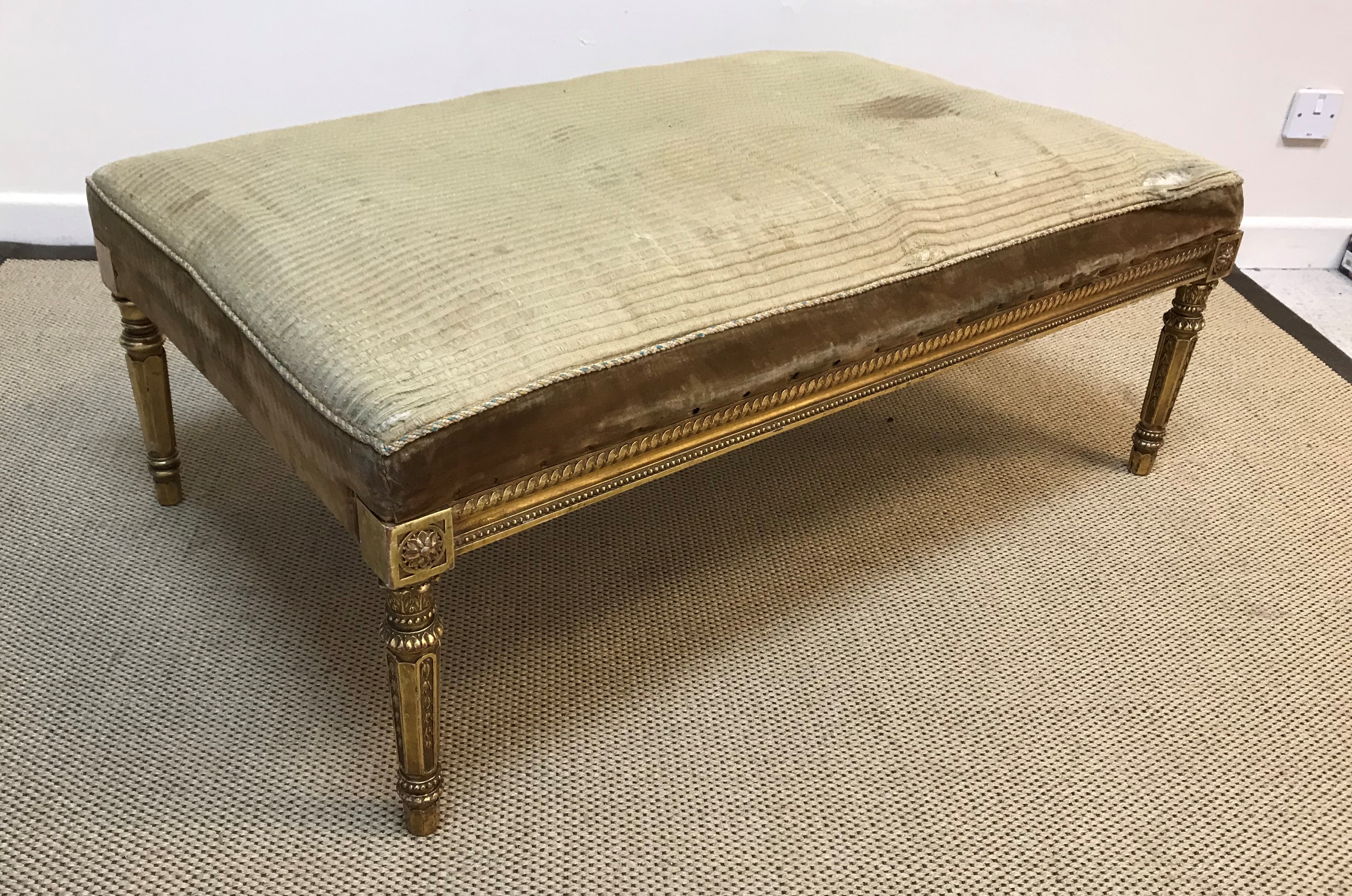 A 19th Century French carved giltwood and gesso framed drawing room stool, the cord upholstered seat