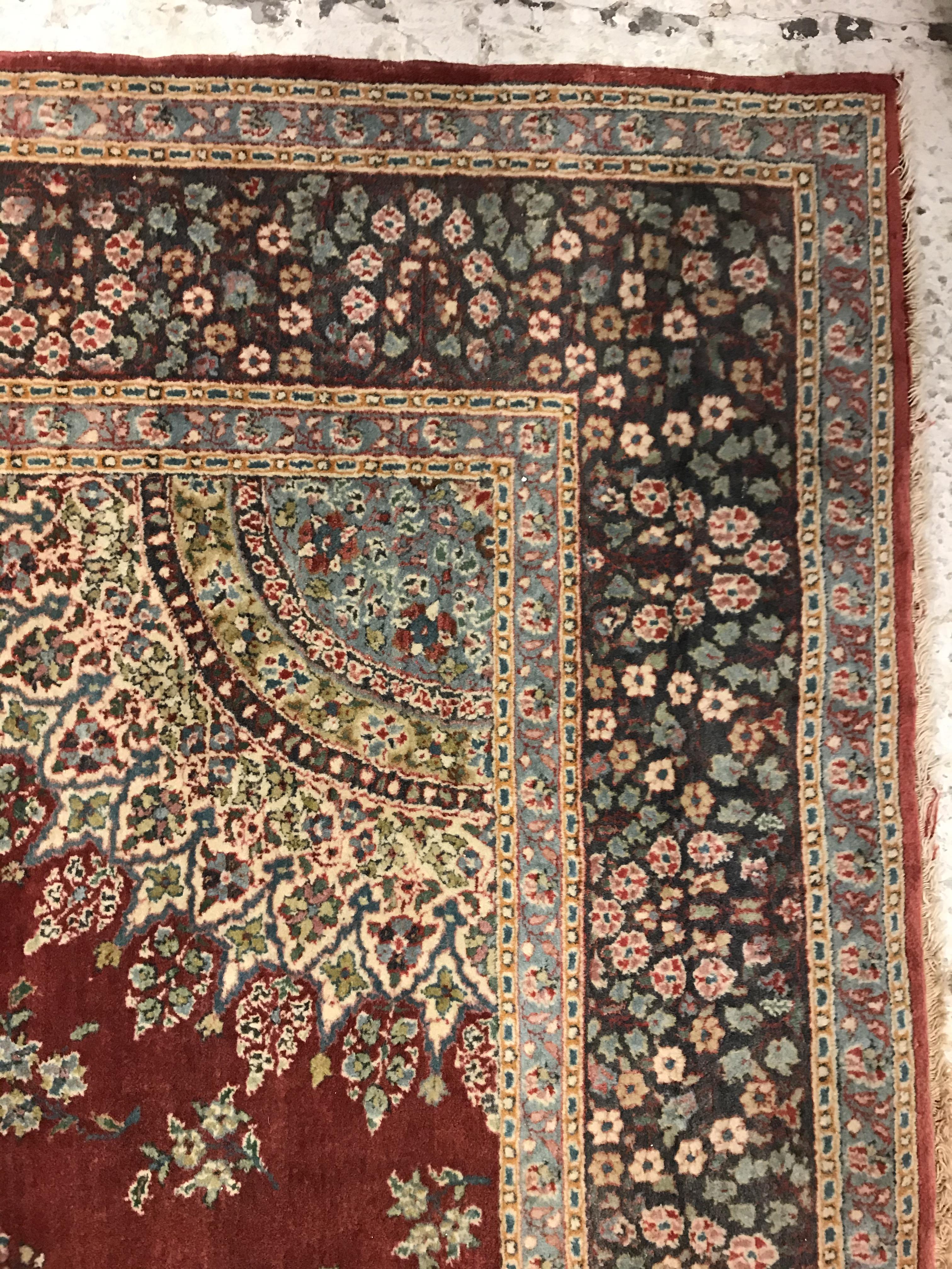 A pair of fine Oriental rugs, the central panels each set with floral decorated circular medallion - Image 34 of 41