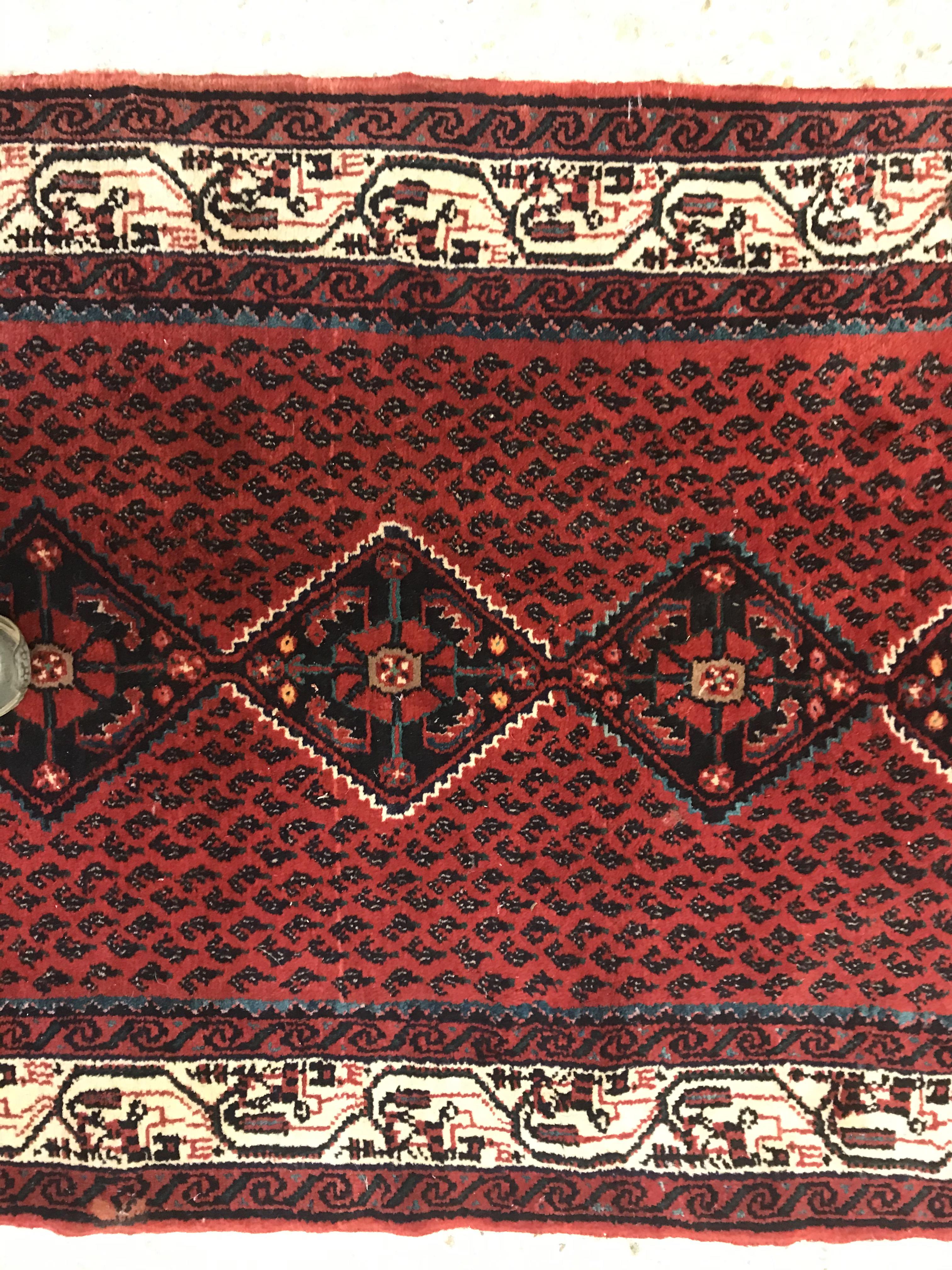 A modern Persian (Iran) runner, the red ground with repeating lozenge medallion with hook style - Image 11 of 23