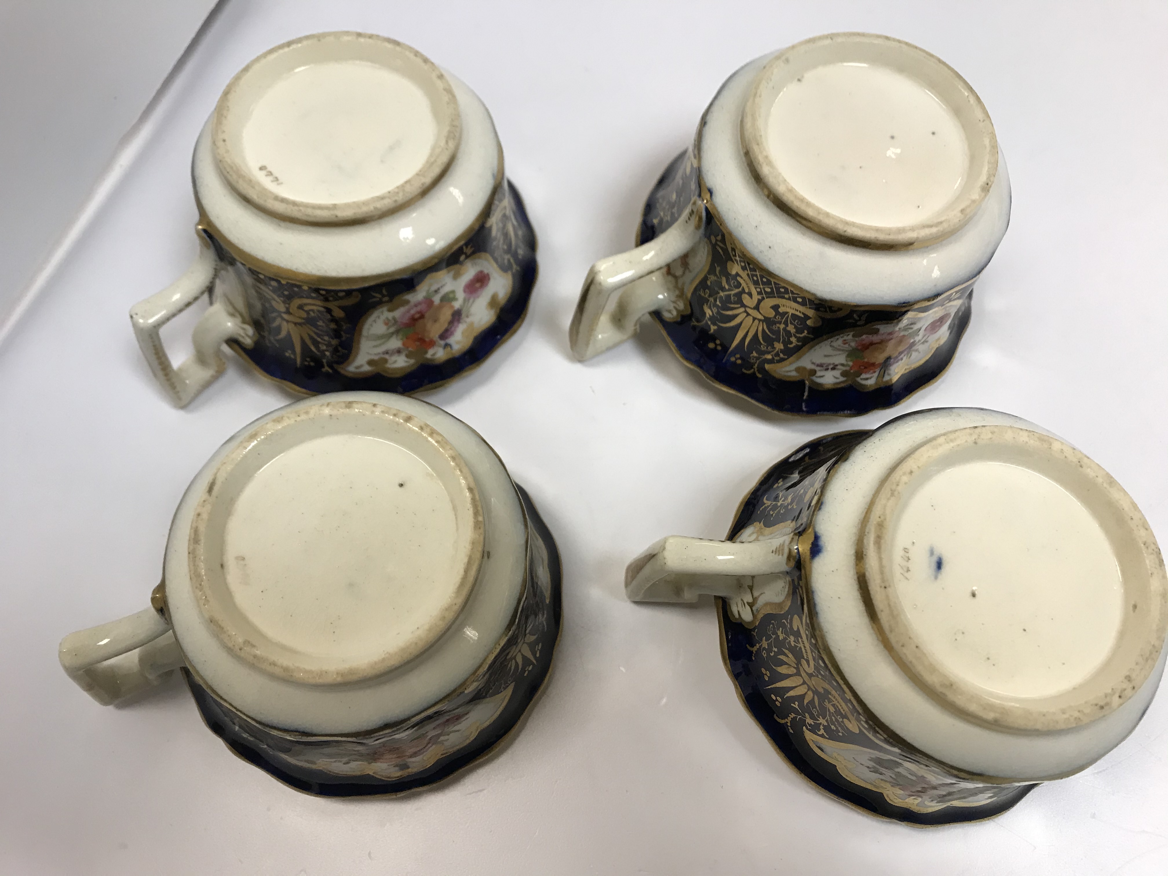 A 19th Century Staffordshire pottery part tea set, royal blue banded and gilt lined with panels of - Image 18 of 45