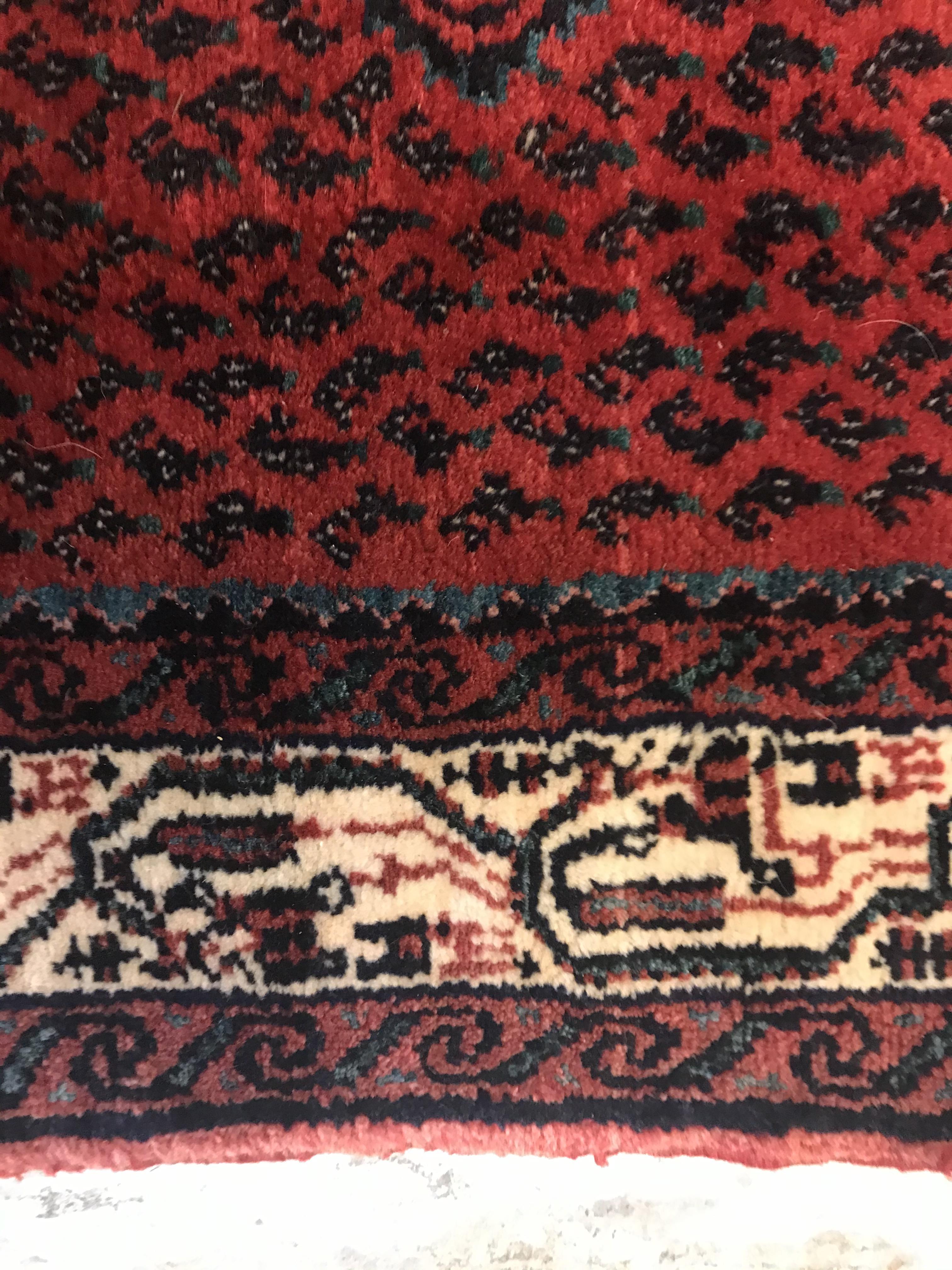 A modern Persian (Iran) runner, the red ground with repeating lozenge medallion with hook style - Image 16 of 23