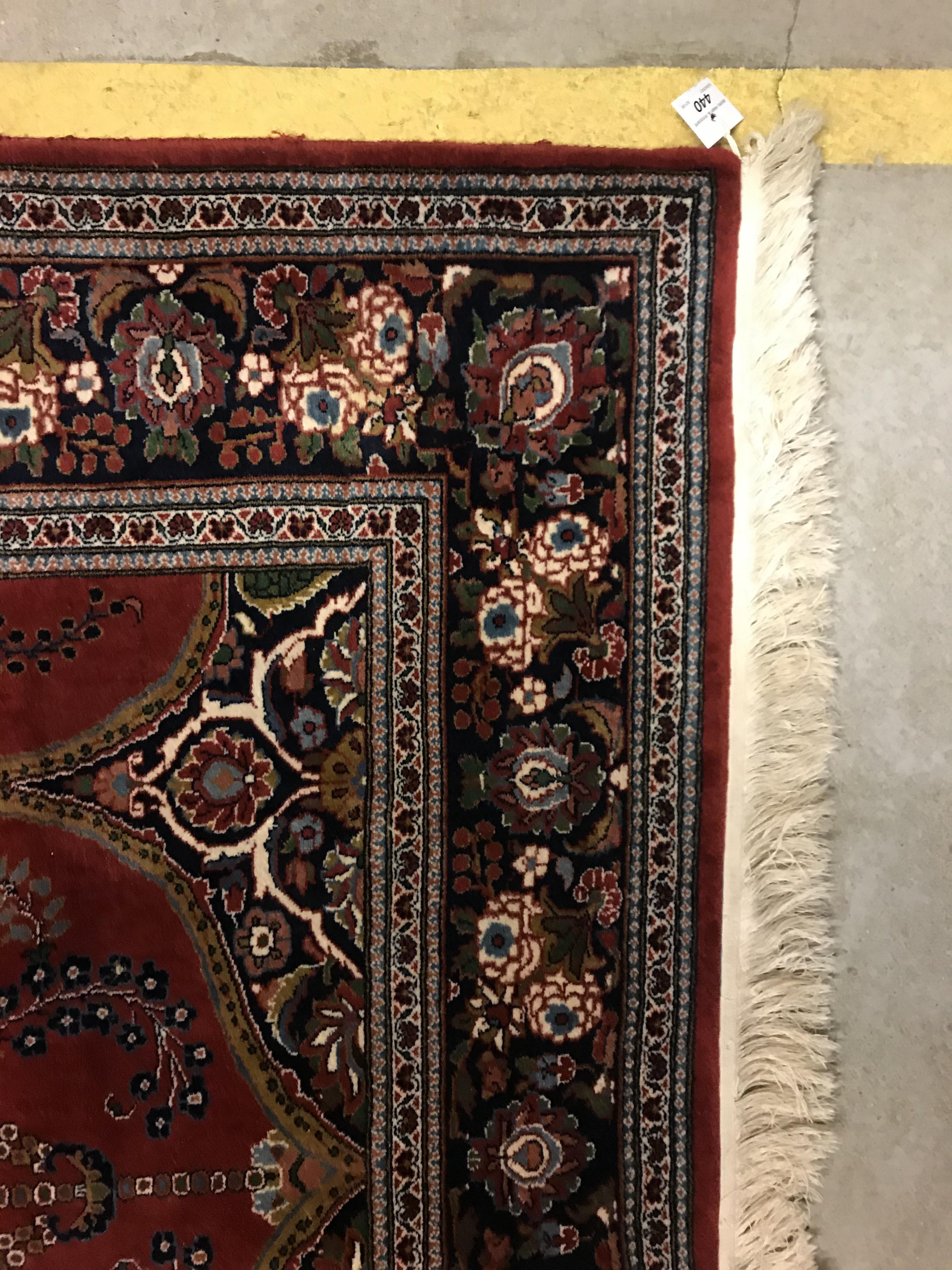 A Kashan prayer rug, the central panel set with Mirhab design with vase of flowers to base, on a red - Image 10 of 13