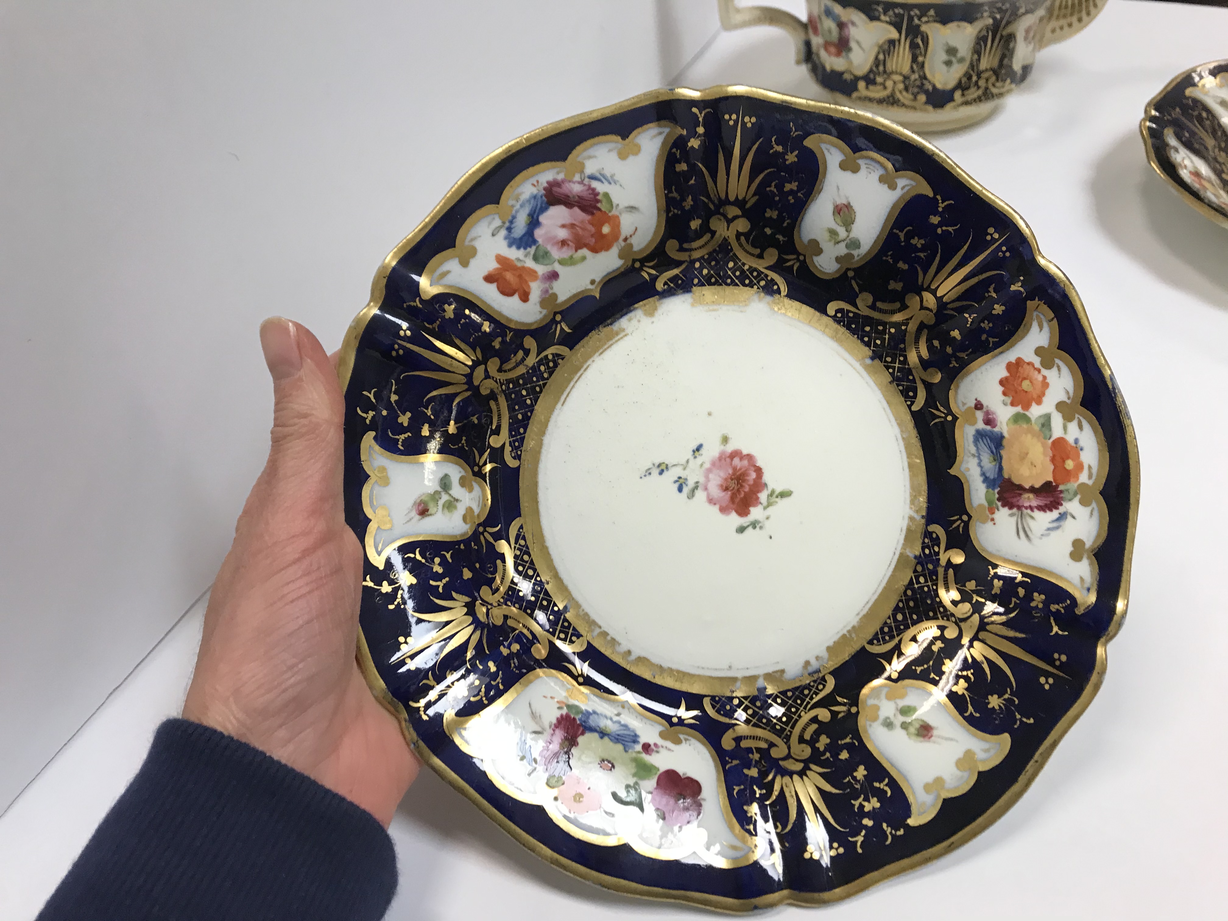 A 19th Century Staffordshire pottery part tea set, royal blue banded and gilt lined with panels of - Image 14 of 45