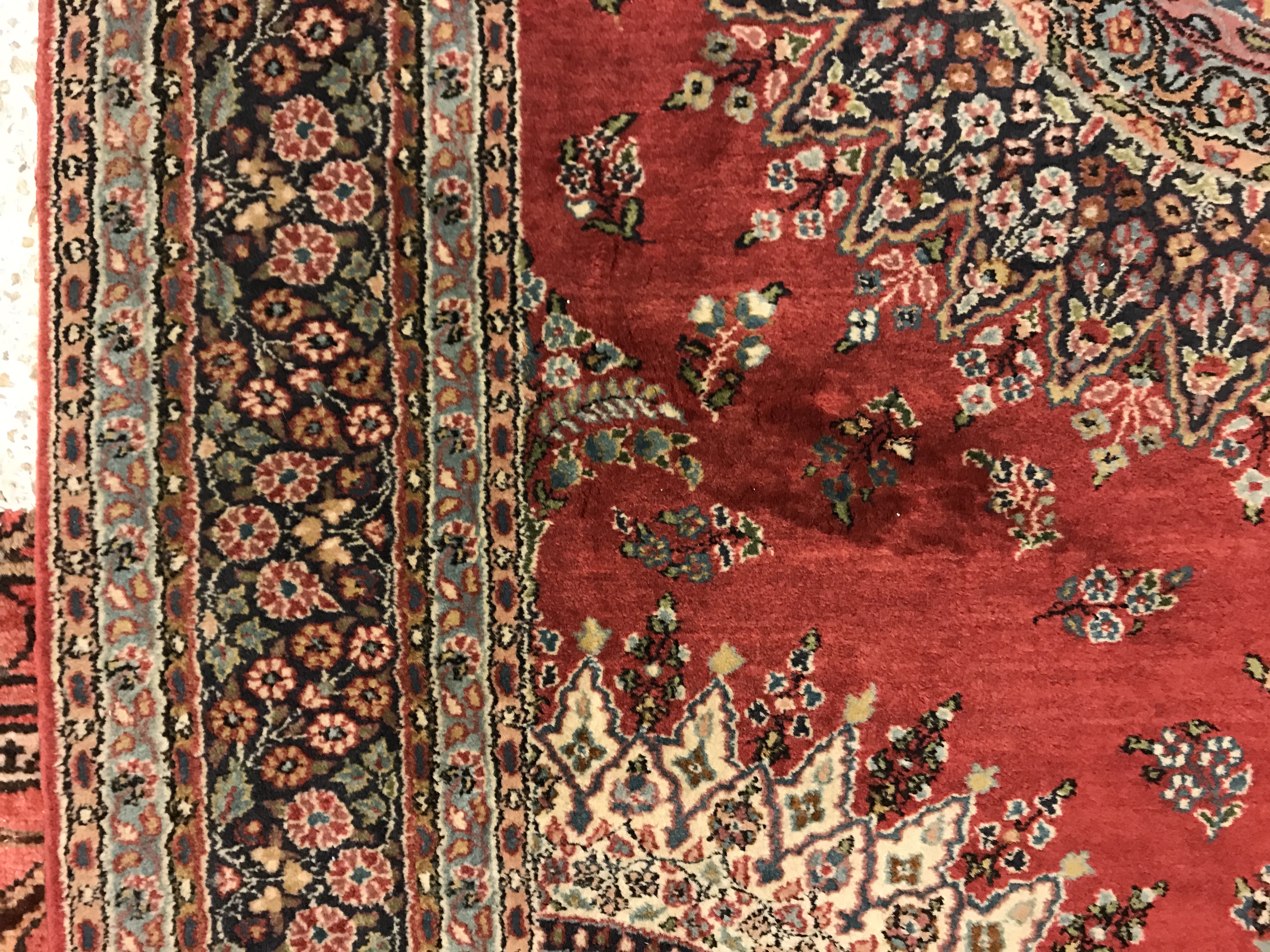 A pair of fine Oriental rugs, the central panel set with floral decorated circular medallion on a - Image 38 of 48
