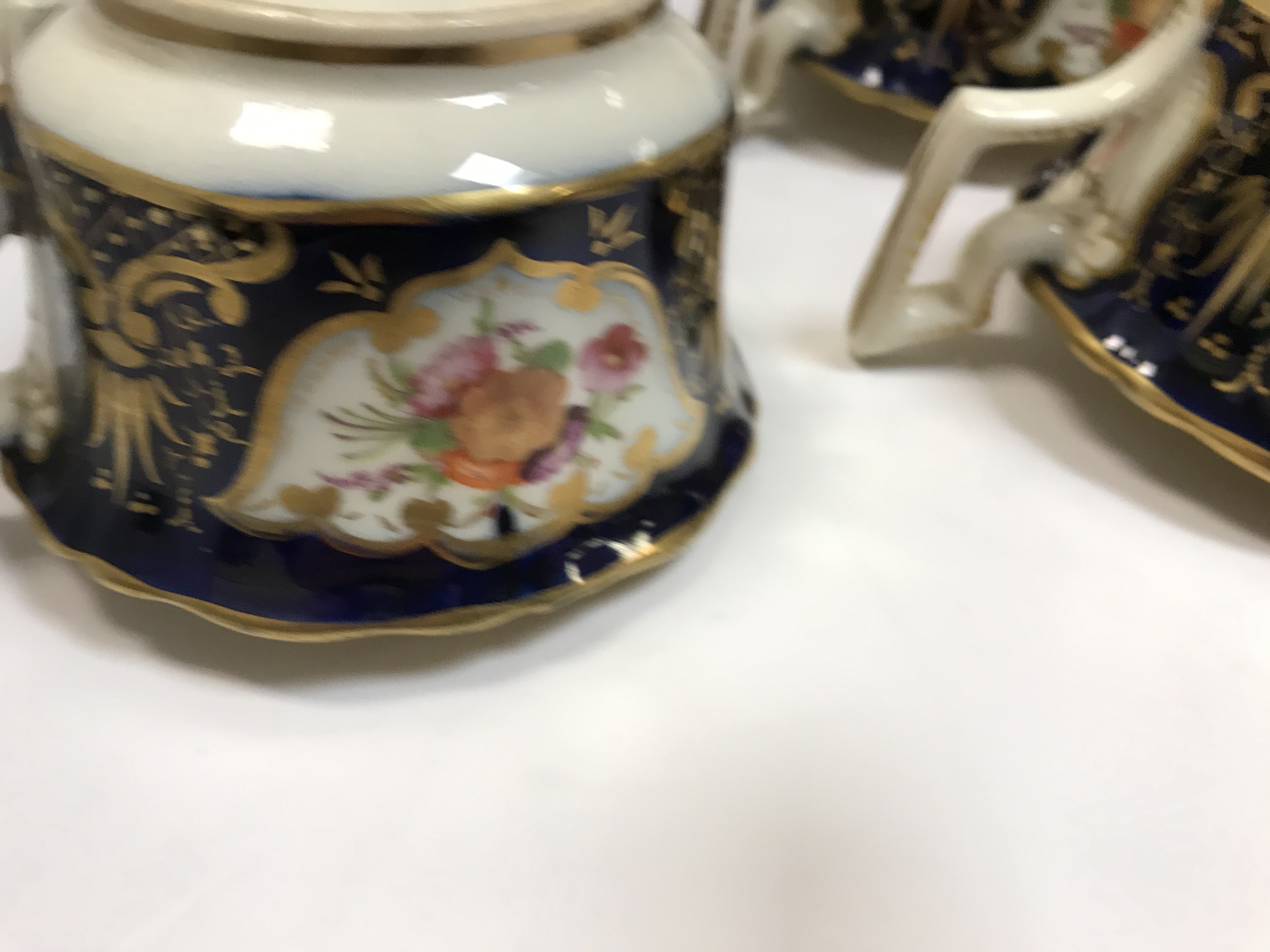 A 19th Century Staffordshire pottery part tea set, royal blue banded and gilt lined with panels of - Image 19 of 45