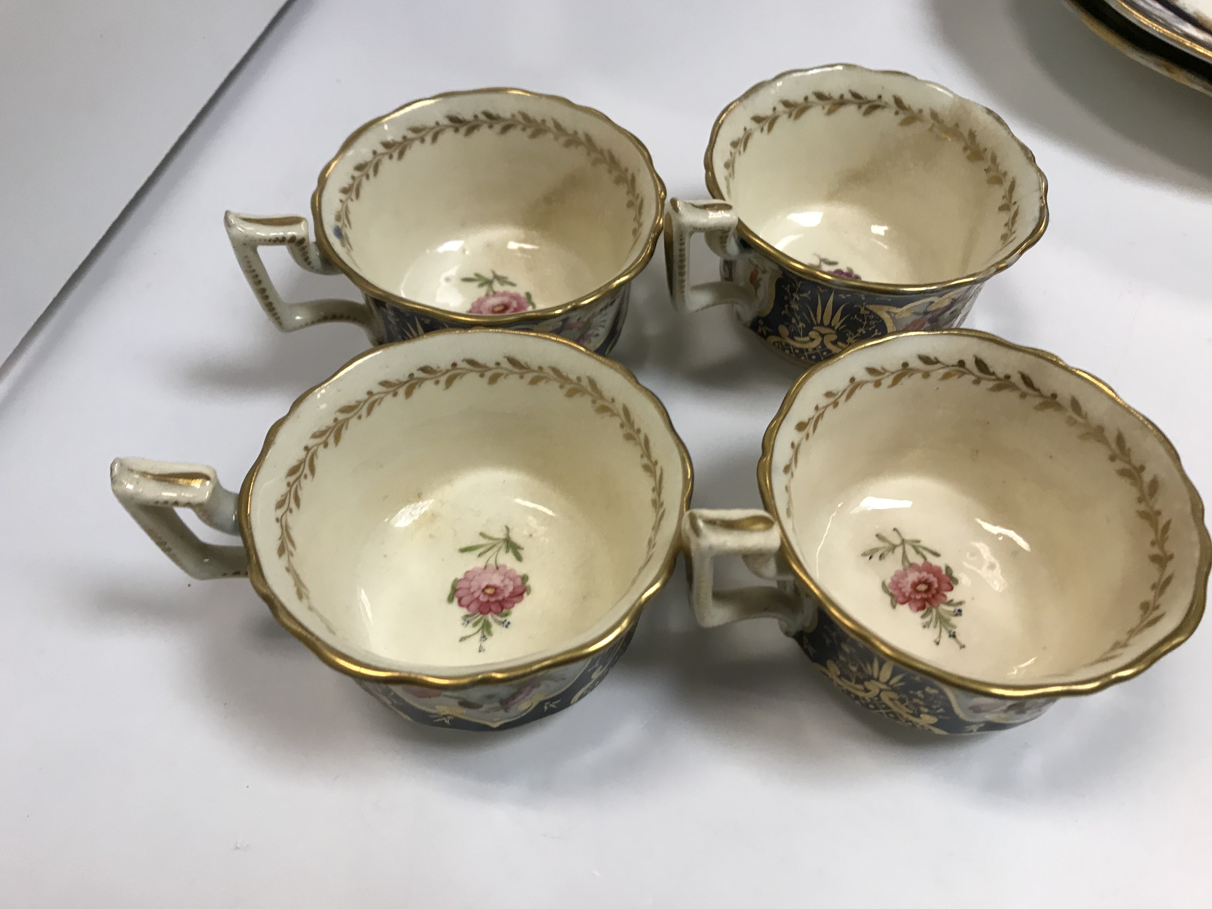 A 19th Century Staffordshire pottery part tea set, royal blue banded and gilt lined with panels of - Image 17 of 45