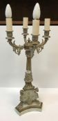A pair of 20th Century brass four light table lamps in the Empire style, with scrolling foliate