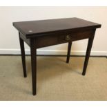 A 19th Century mahogany tea table in the Provincial Chippendale taste, the plain top opening to