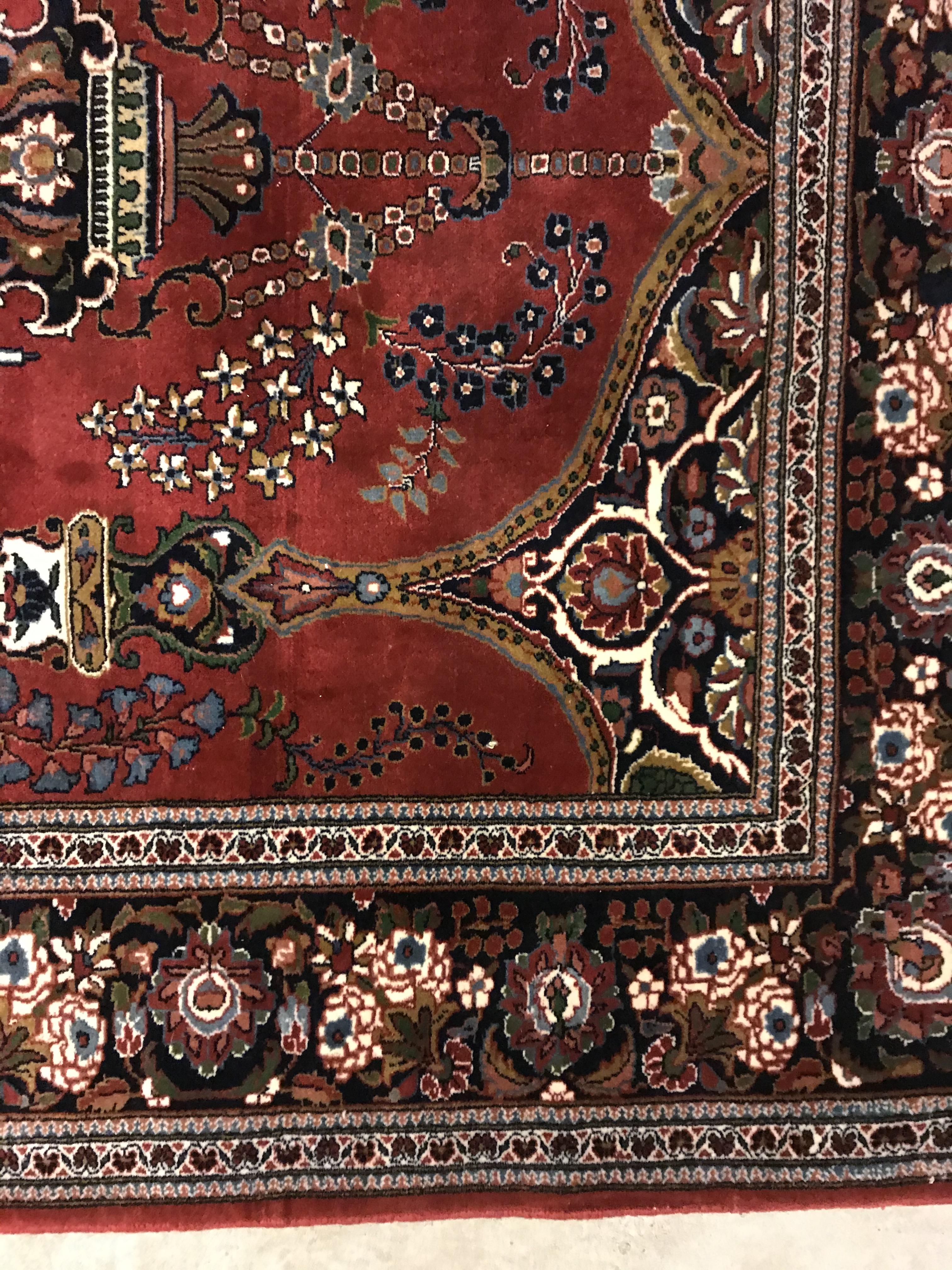 A Kashan prayer rug, the central panel set with Mirhab design with vase of flowers to base, on a red - Image 8 of 13