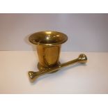 A 19th Century Russian brass mortar of inverted bell form with ring decoration to the flared rim,