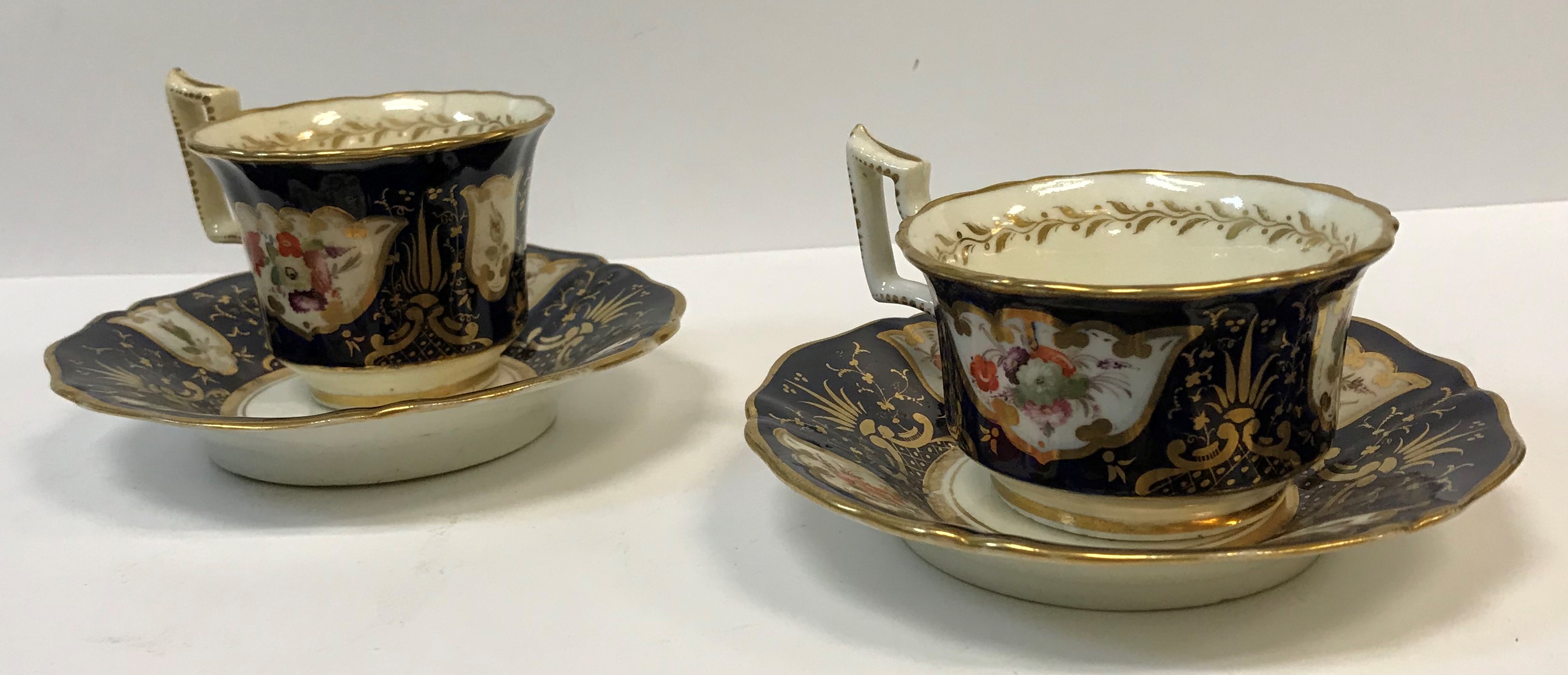 A 19th Century Staffordshire pottery part tea set, royal blue banded and gilt lined with panels of - Image 2 of 45