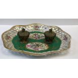 A 19th Century Continental porcelain desk stand, the centre field decorated with panels of birds