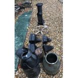 A collection of four Victorian cast iron rain hoppers, together with a cast iron greenhouse stove,