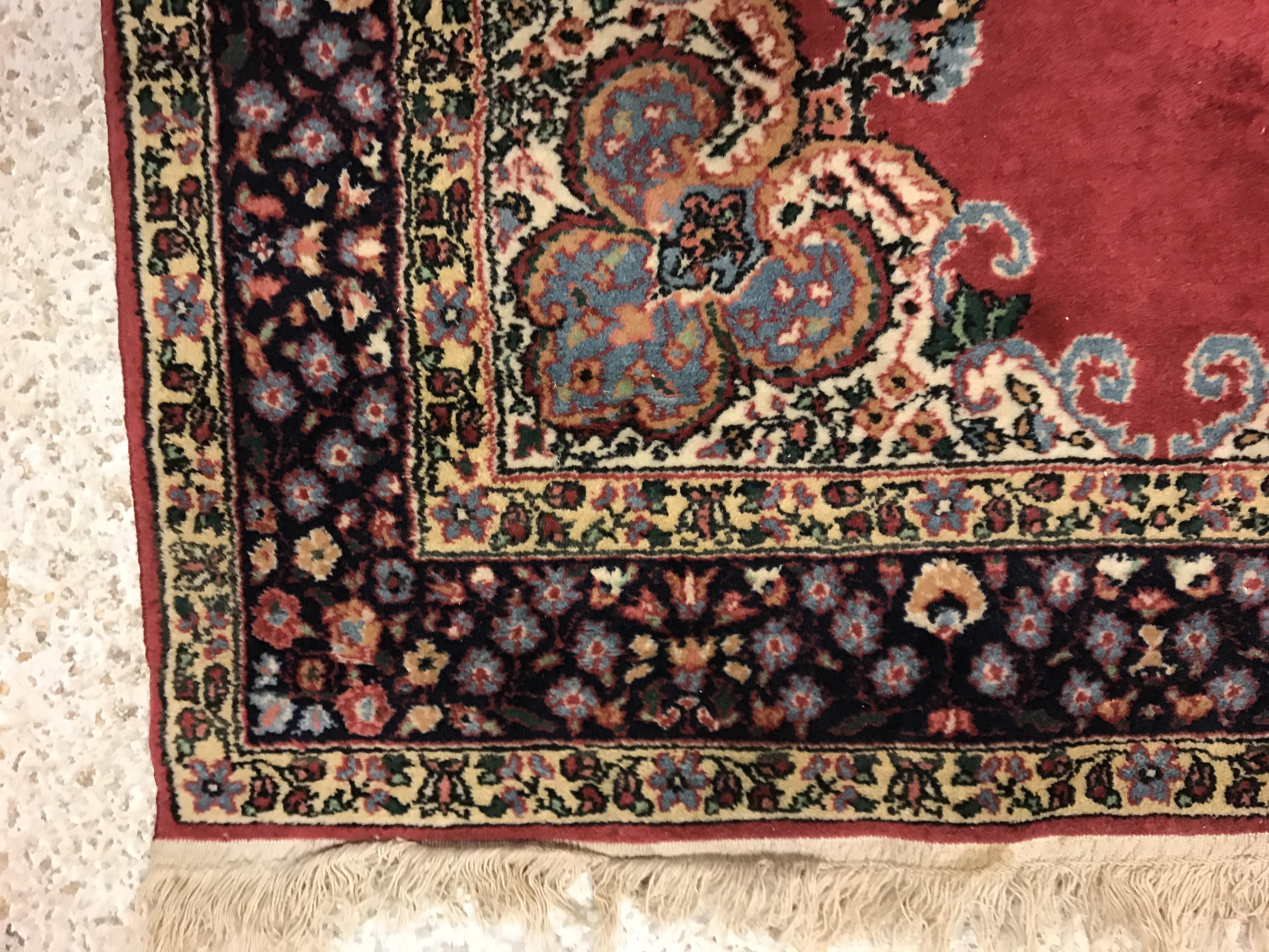 A pair of fine Oriental rugs, the central panels set with floral decorated circular medallion on a - Image 20 of 41