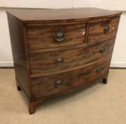 A 19th Century mahogany bow fronted chest of two short over two long graduated drawers on splayed